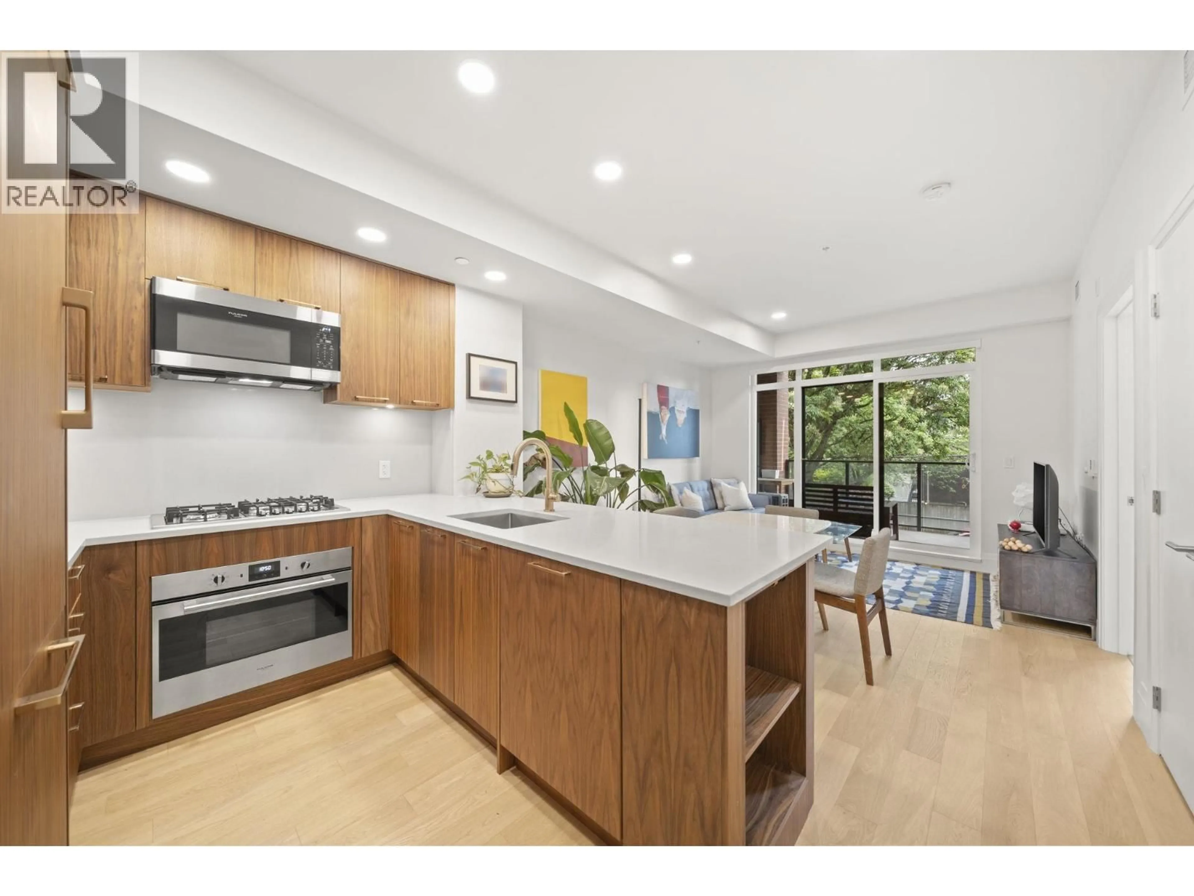 Open concept kitchen, unknown for 205 - 2550 GARDEN DRIVE, Vancouver British Columbia V5N4X6