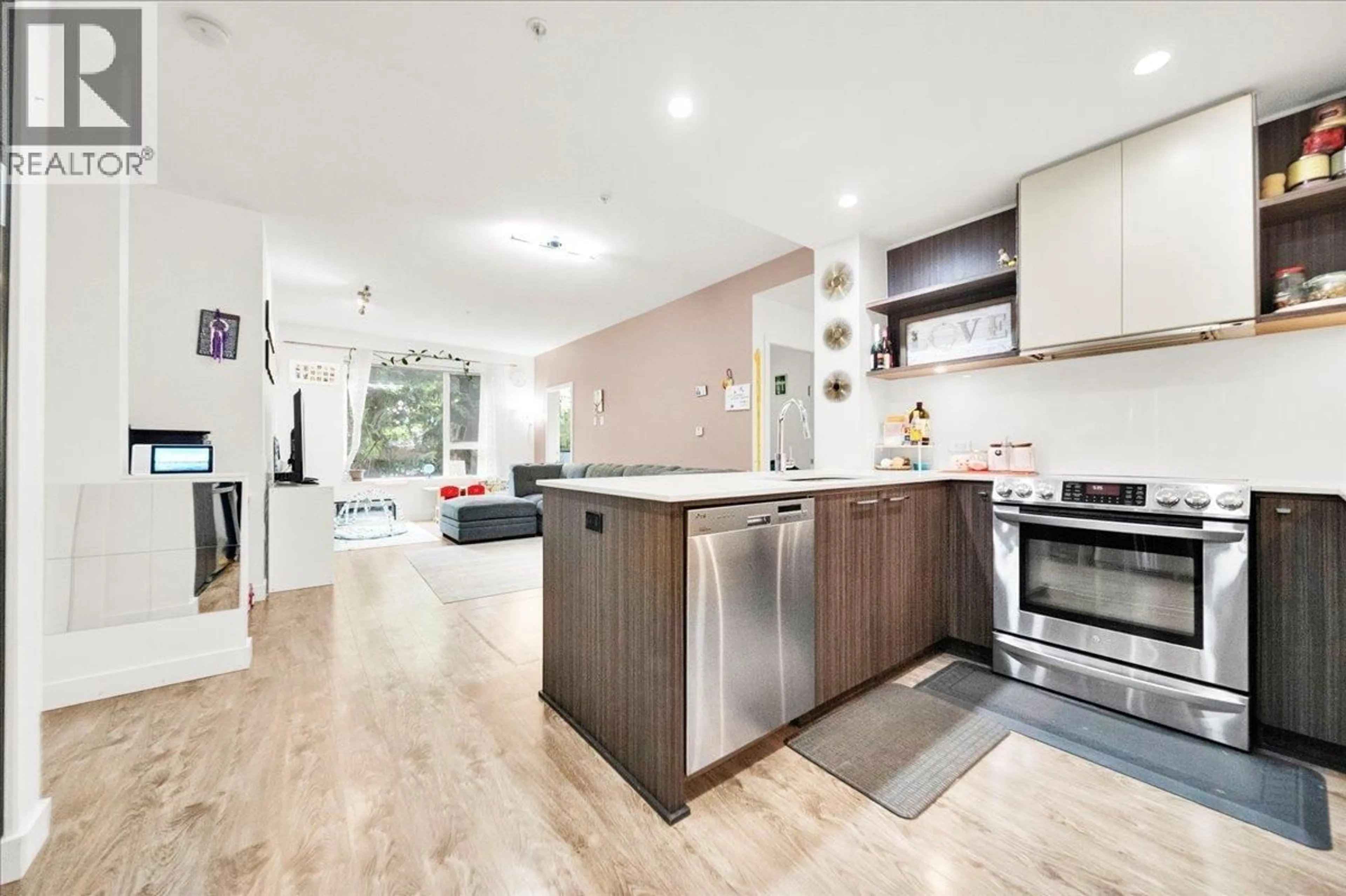 Open concept kitchen, wood/laminate floor for 218 - 9250 UNIVERSITY HIGH STREET, Burnaby British Columbia V5A0B3