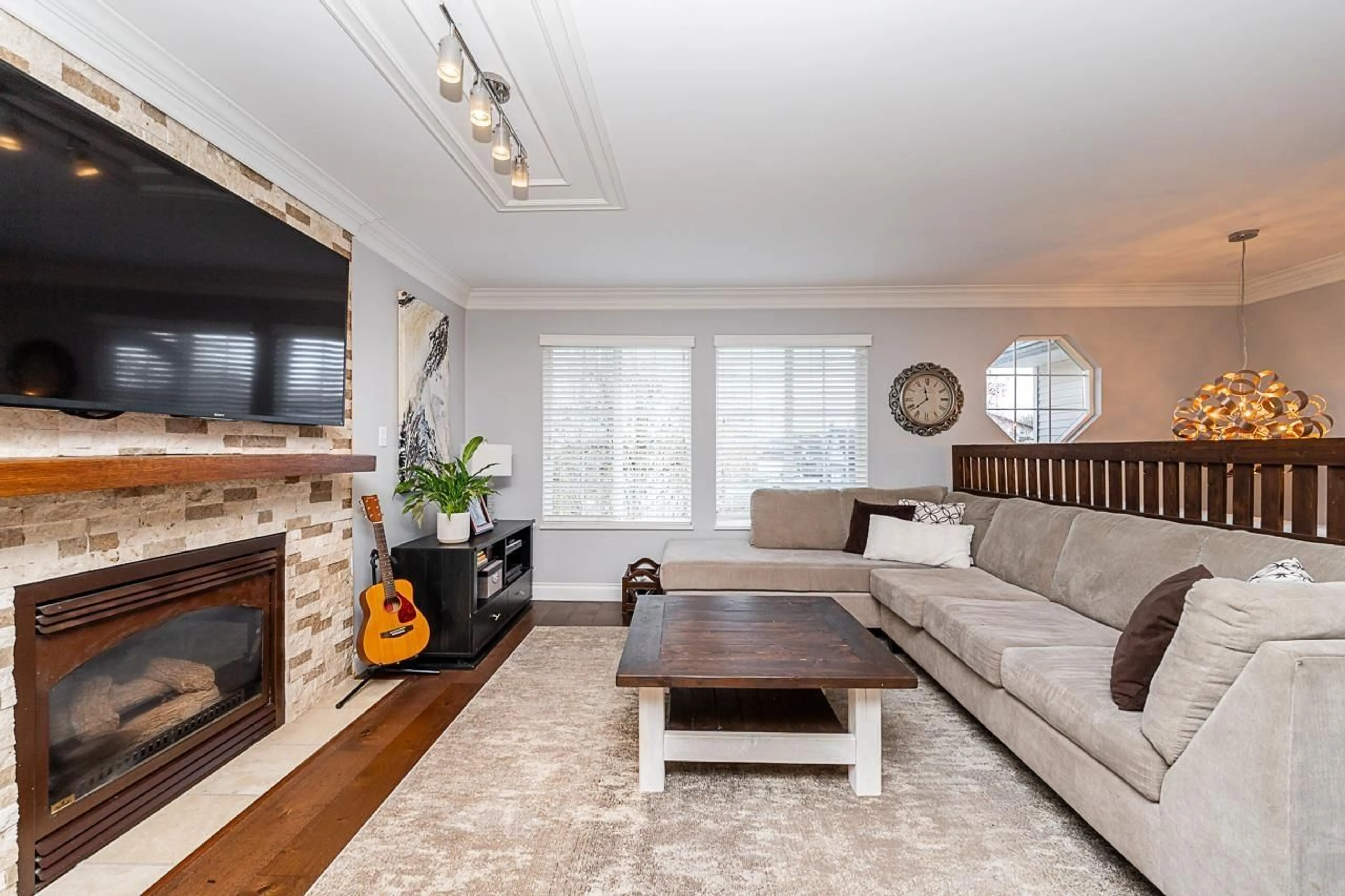 Living room with furniture, wood/laminate floor for 4633 222A STREET, Langley British Columbia V2Z1M4
