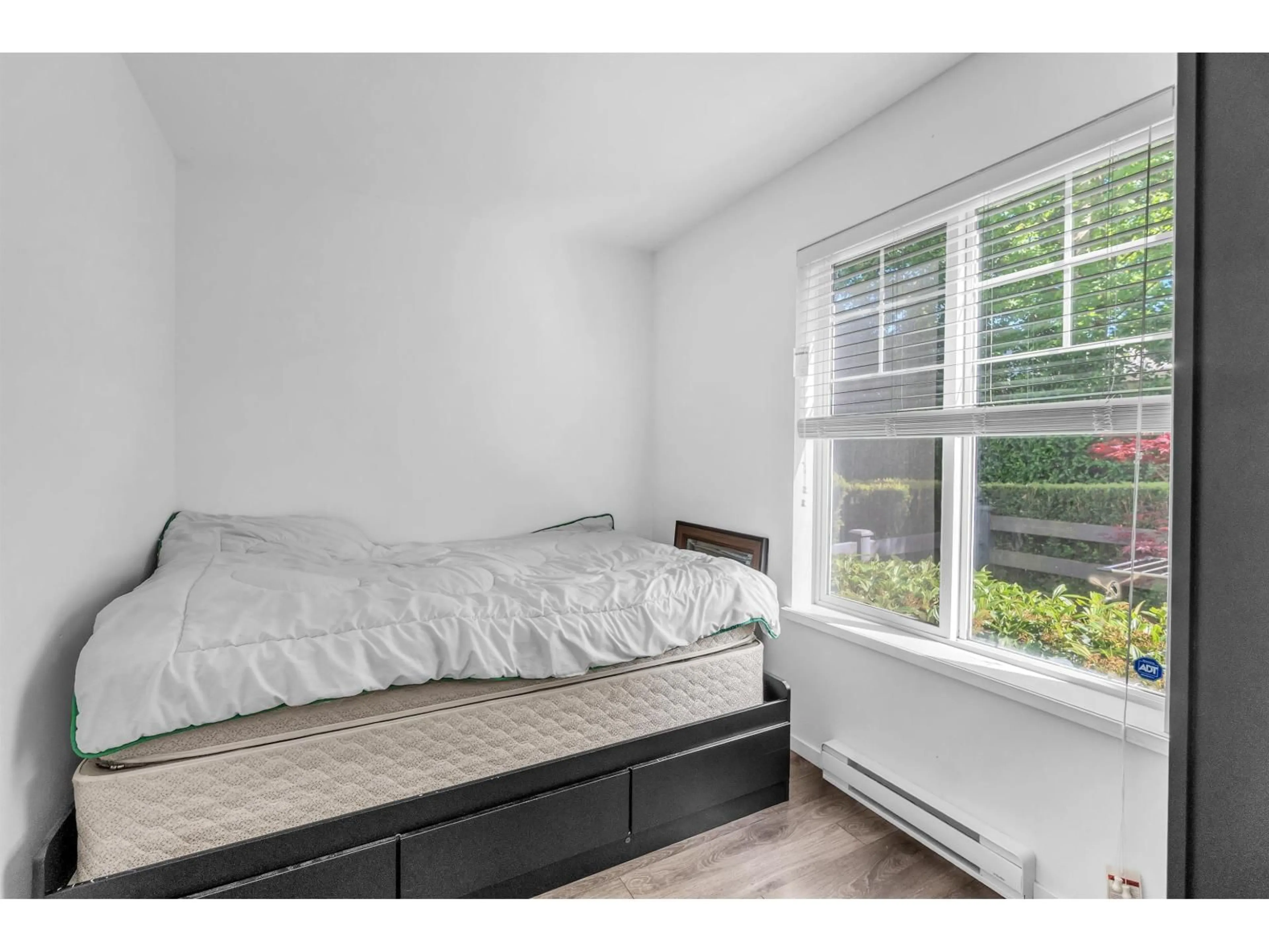 Bedroom with bed, wood/laminate floor for 130 - 8130 136A STREET, Surrey British Columbia V3W1H9