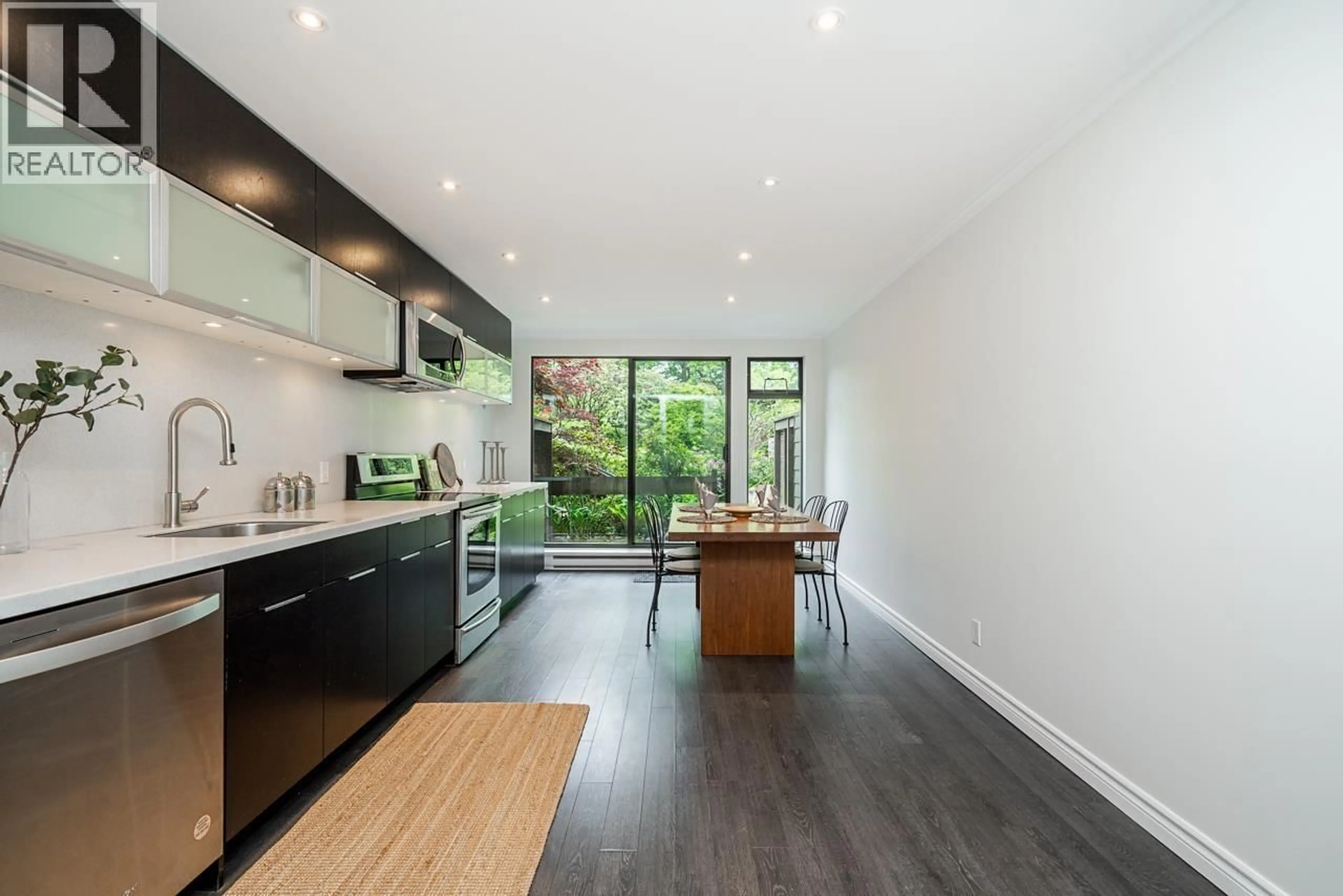 Contemporary kitchen, wood/laminate floor for 697 MOBERLY ROAD, Vancouver British Columbia V5V4A4