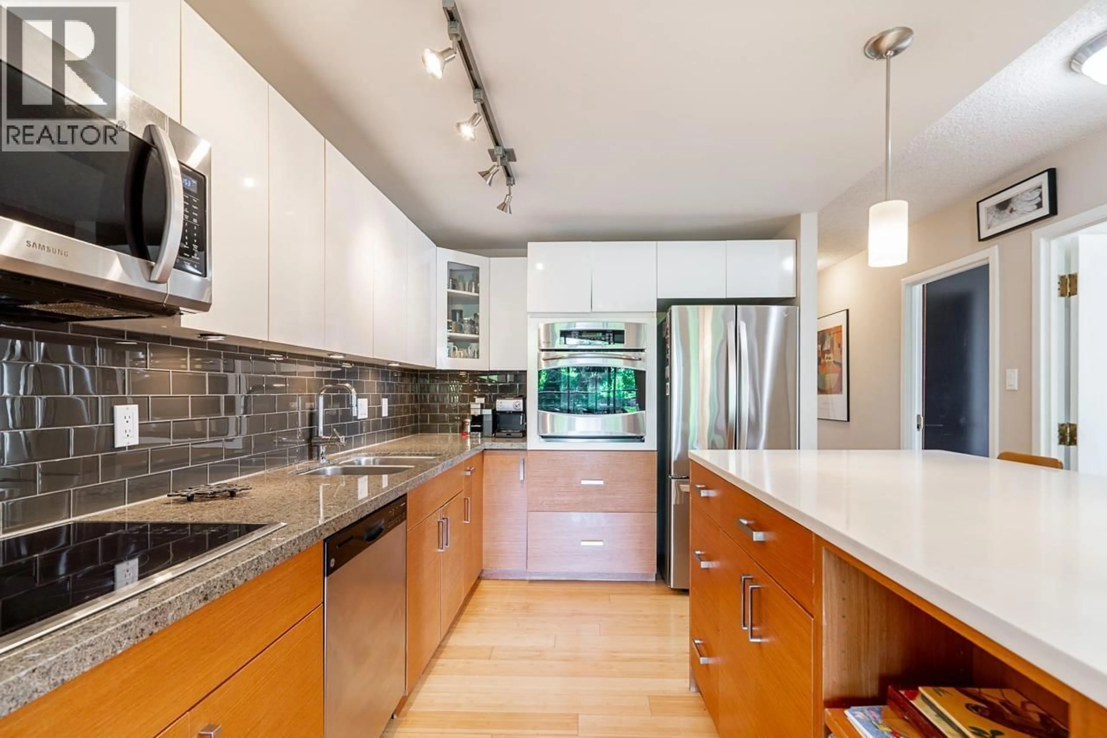 Contemporary kitchen, ceramic/tile floor for 301 - 1450 PENNYFARTHING DRIVE, Vancouver British Columbia V6J4X8
