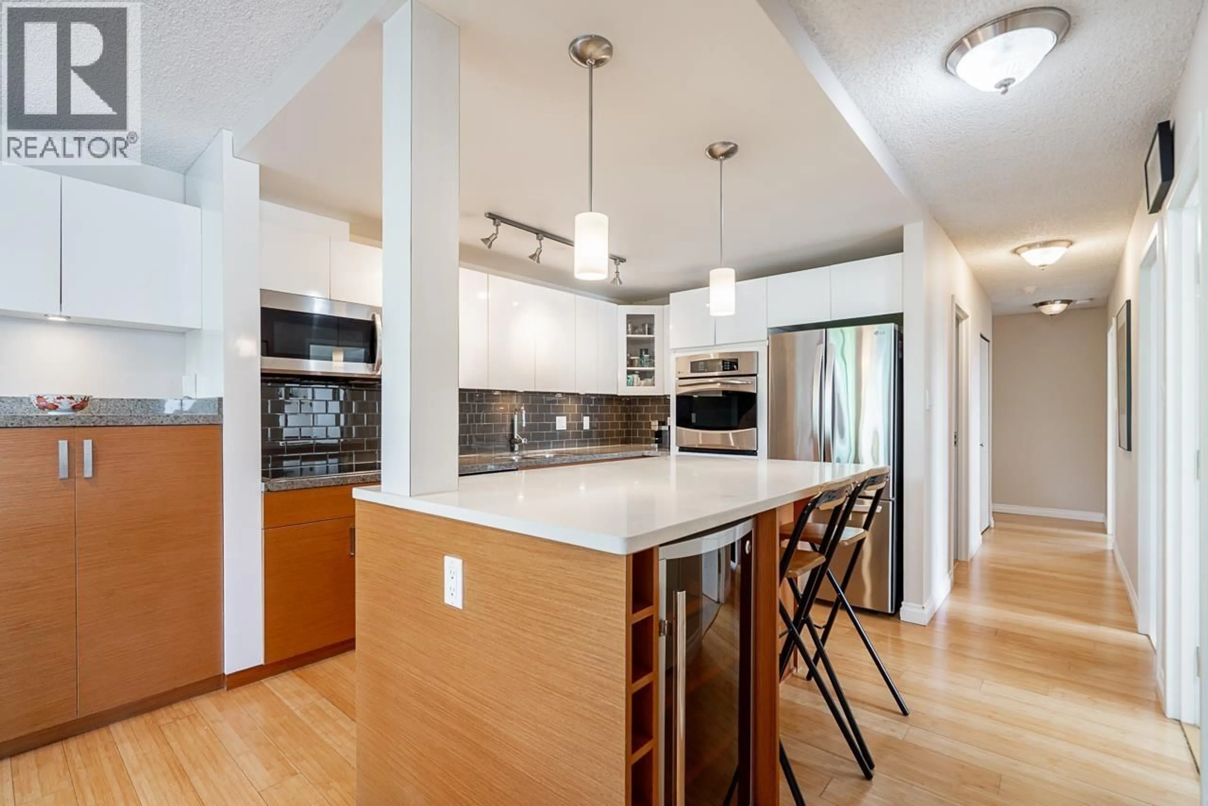 Open concept kitchen, unknown for 301 - 1450 PENNYFARTHING DRIVE, Vancouver British Columbia V6J4X8