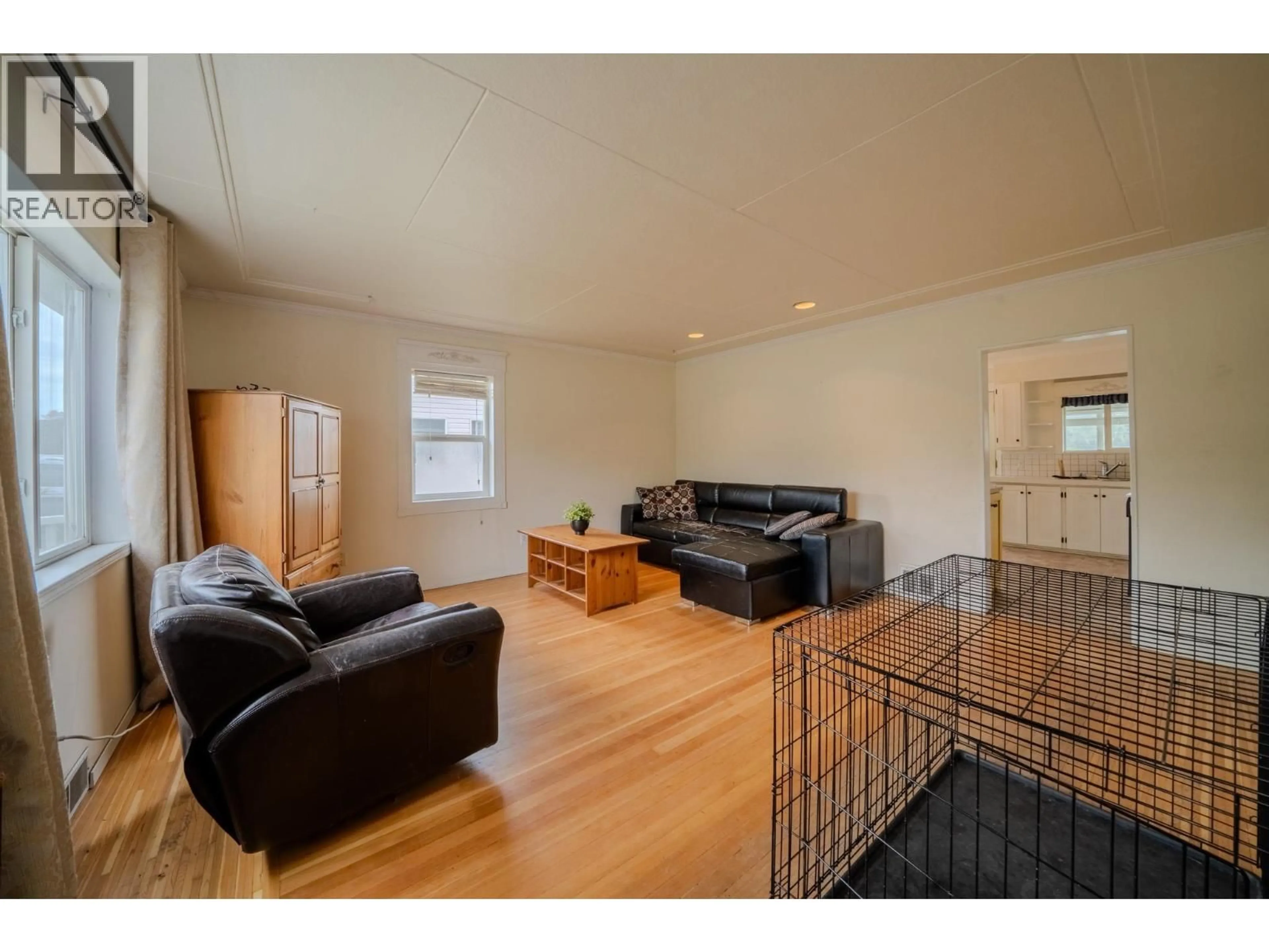 Living room with furniture, wood/laminate floor for 395 FIRST AVENUE, Williams Lake British Columbia V2G1Z1