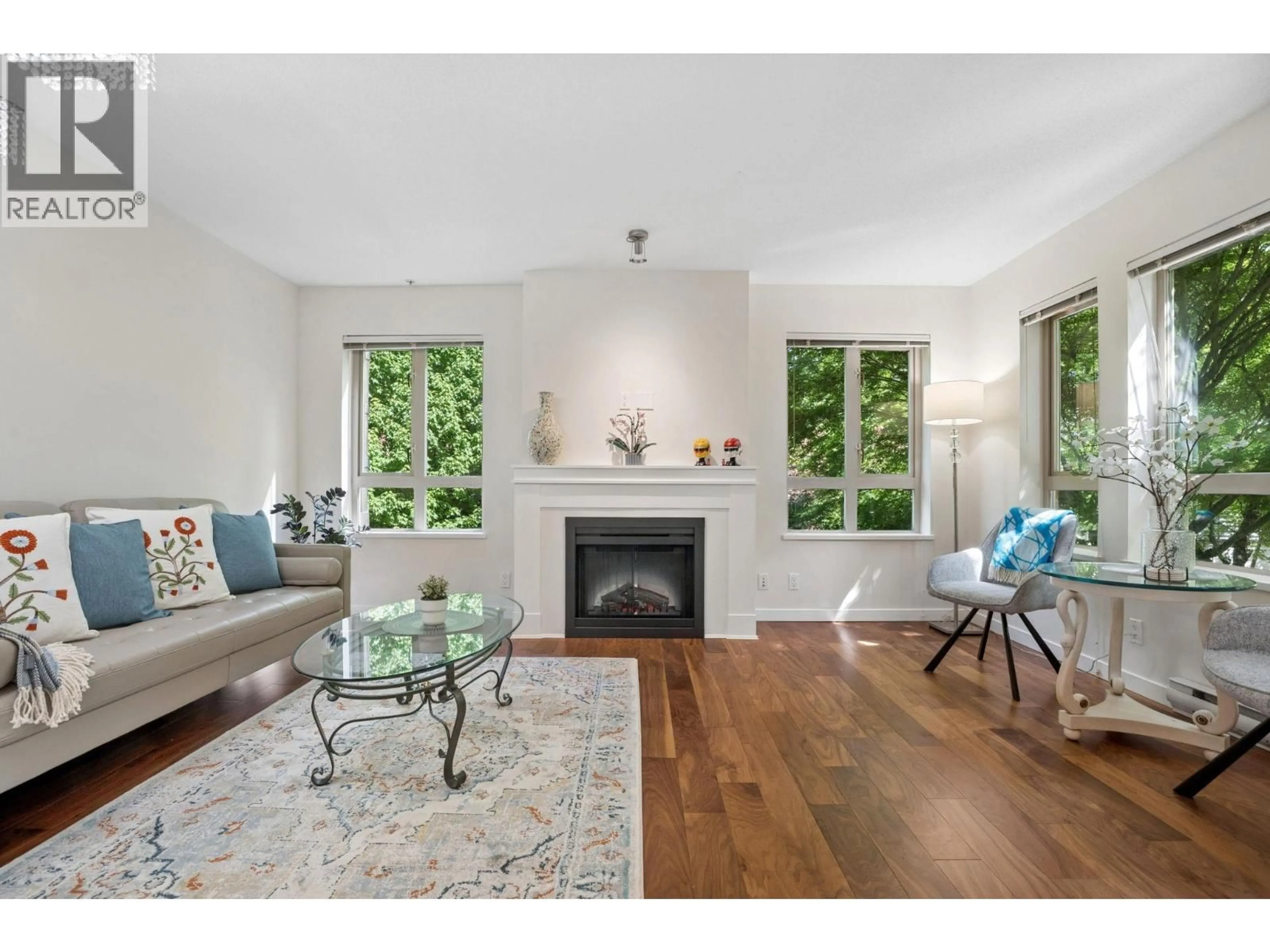Living room with furniture, wood/laminate floor for 206 - 3097 LINCOLN AVENUE, Coquitlam British Columbia V3B0E3