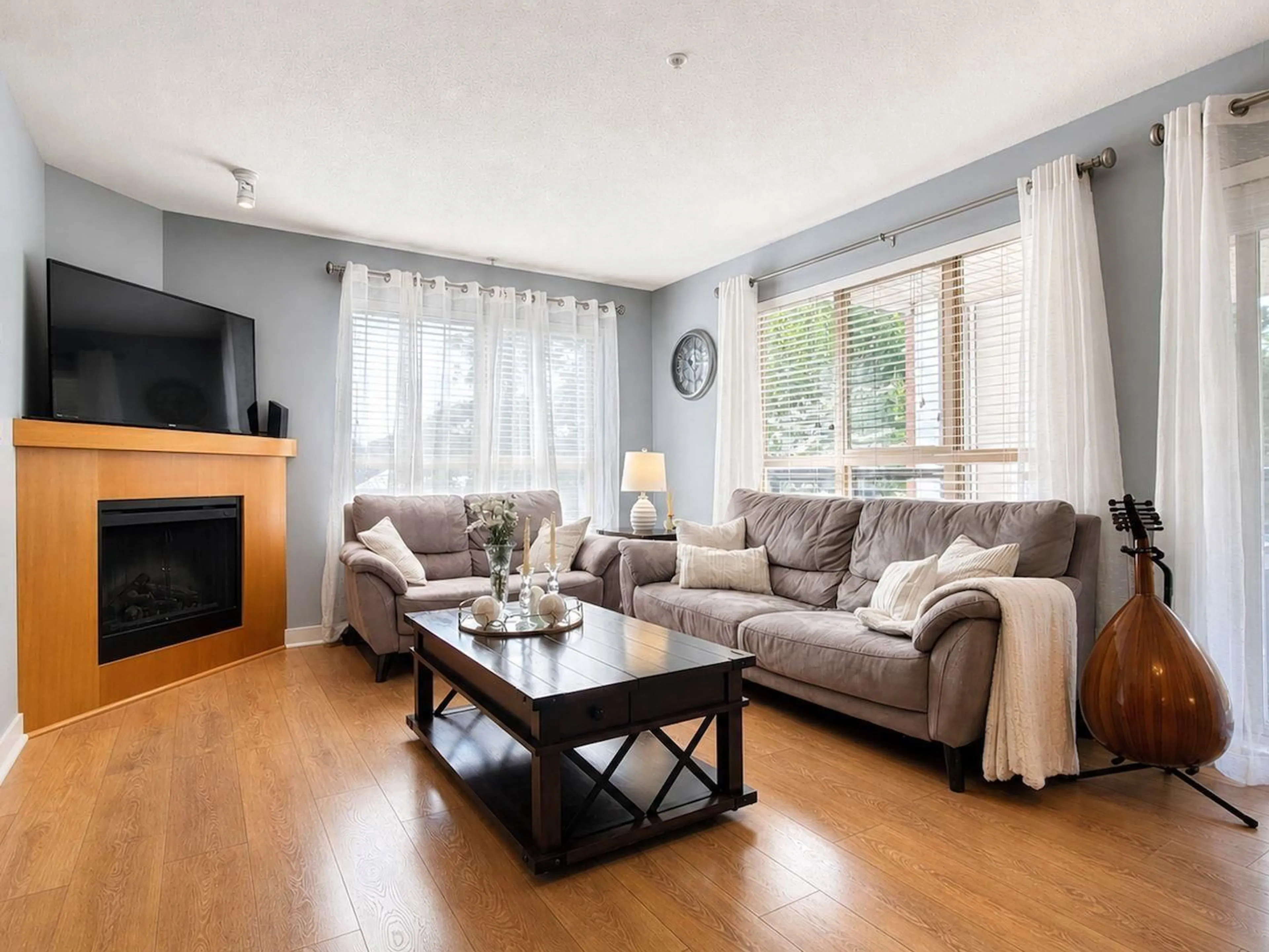 Living room with furniture, wood/laminate floor for A215 - 8929 202 STREET, Langley British Columbia V1M0B4
