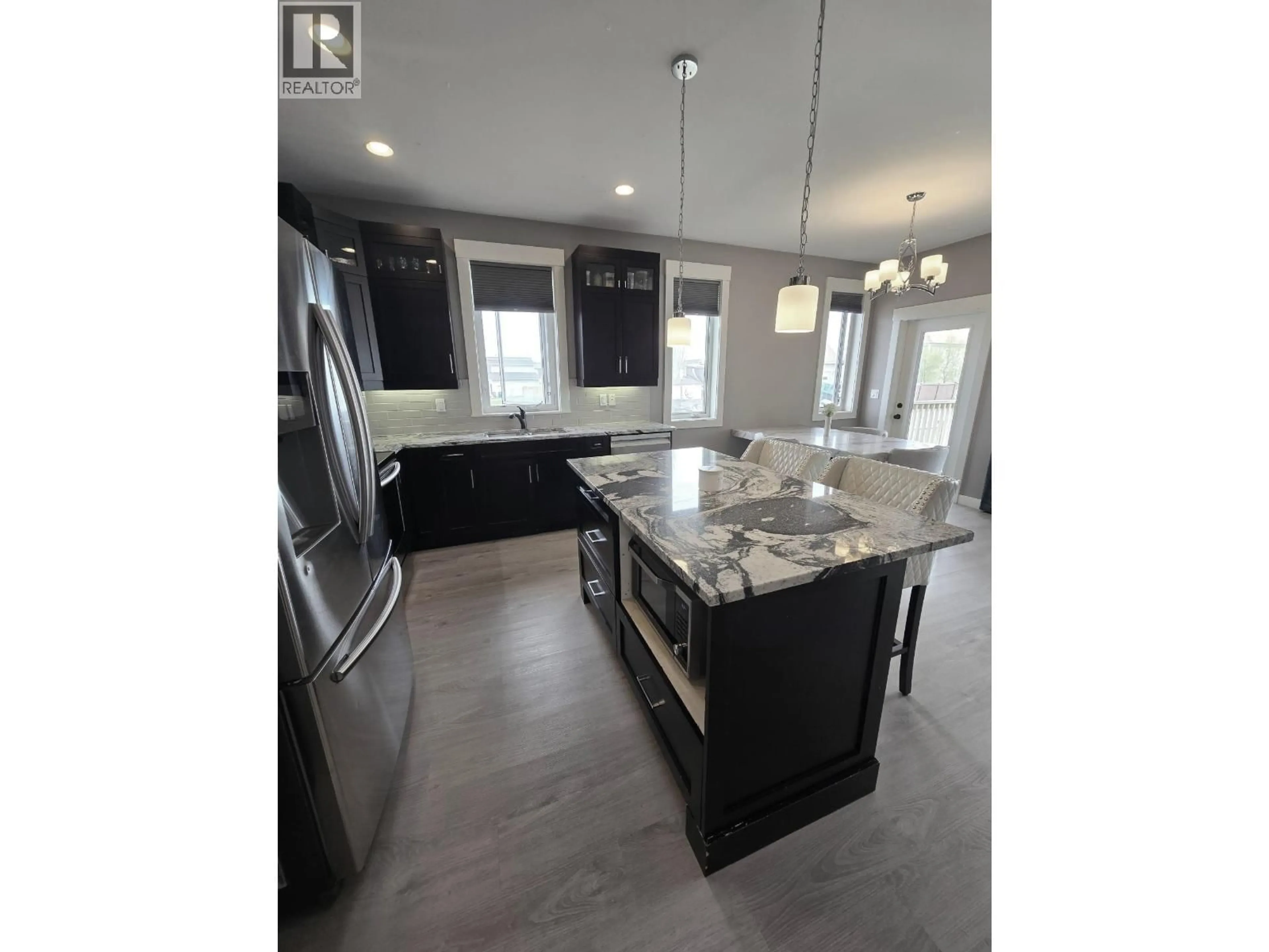 Open concept kitchen, unknown for 10303 115 AVENUE, Fort St. John British Columbia V1J0P8