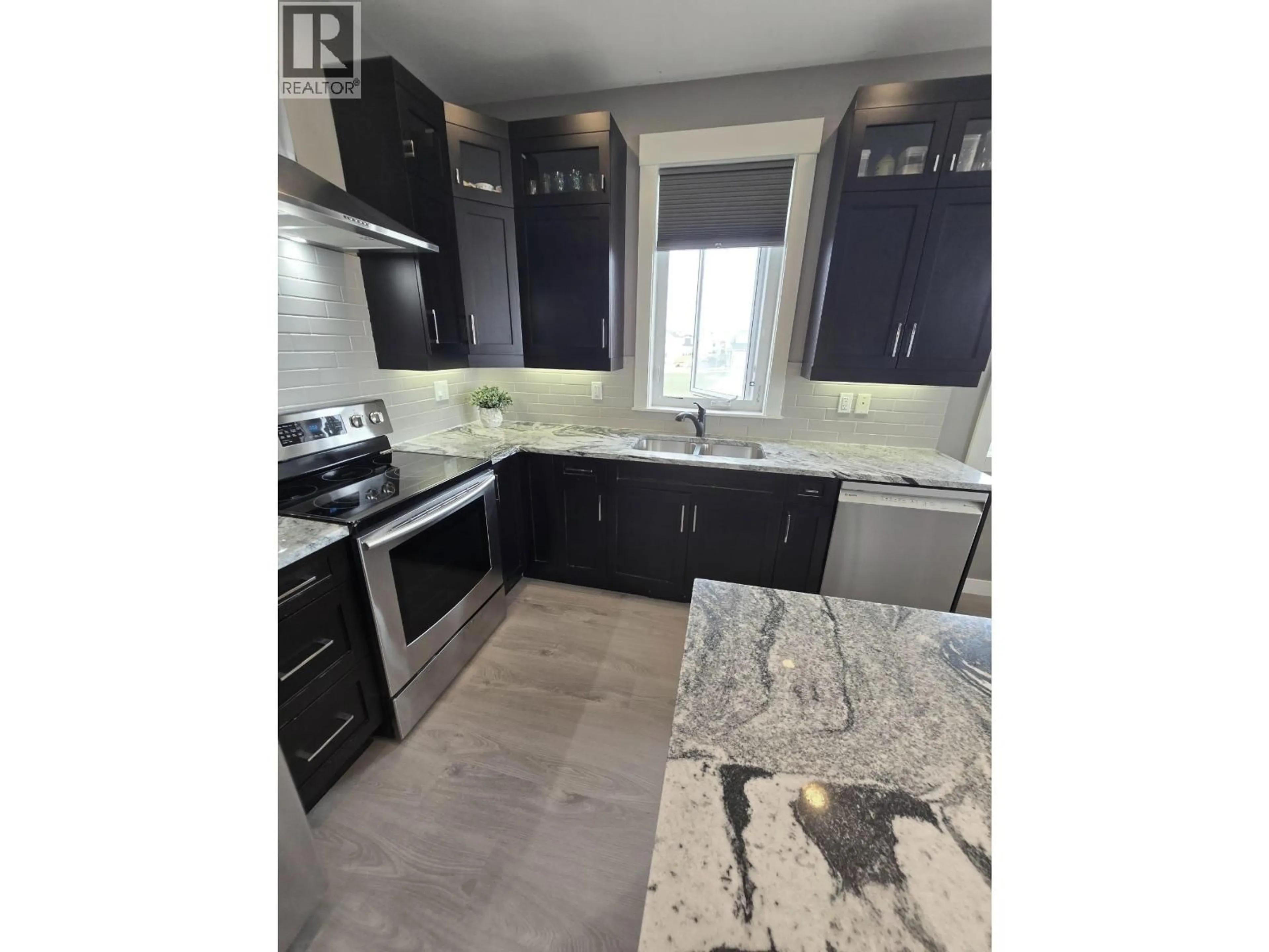 Open concept kitchen, ceramic/tile floor for 10303 115 AVENUE, Fort St. John British Columbia V1J0P8
