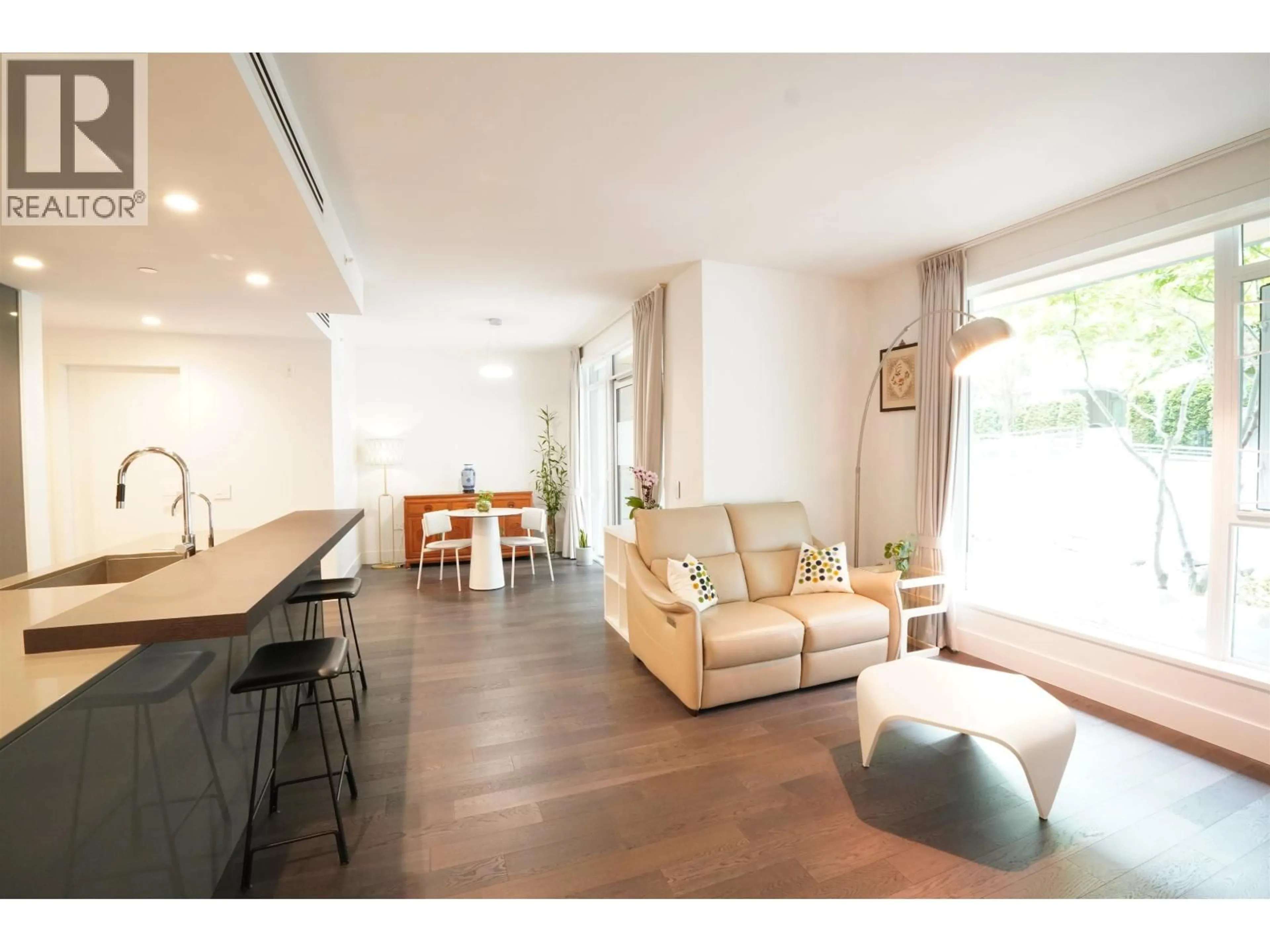 Living room with furniture, wood/laminate floor for 102 - 375 59TH AVENUE, Vancouver British Columbia V5X0J4