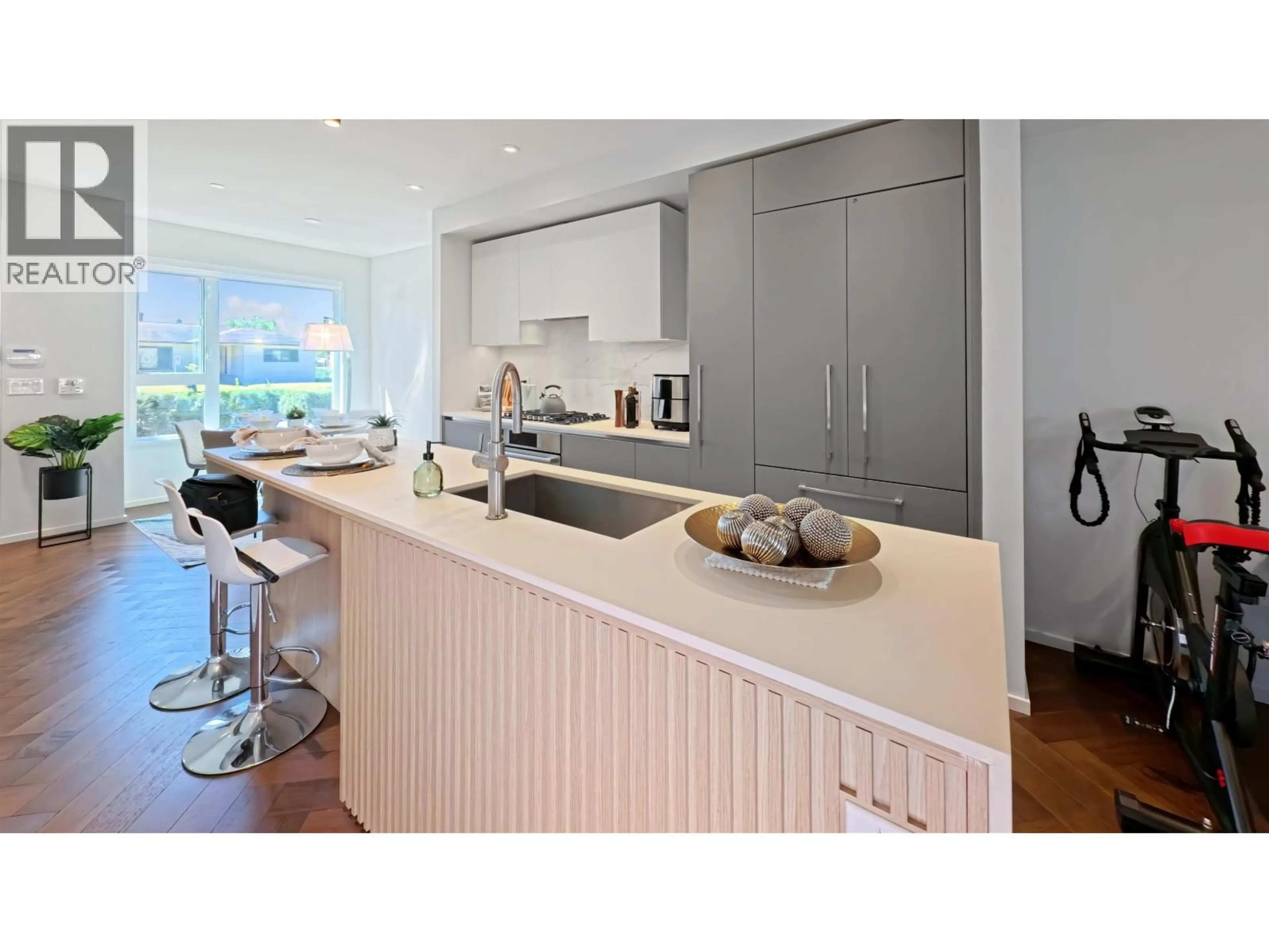 Contemporary kitchen, wood/laminate floor for 153 - 785 49TH AVENUE, Vancouver British Columbia V5Z0A1