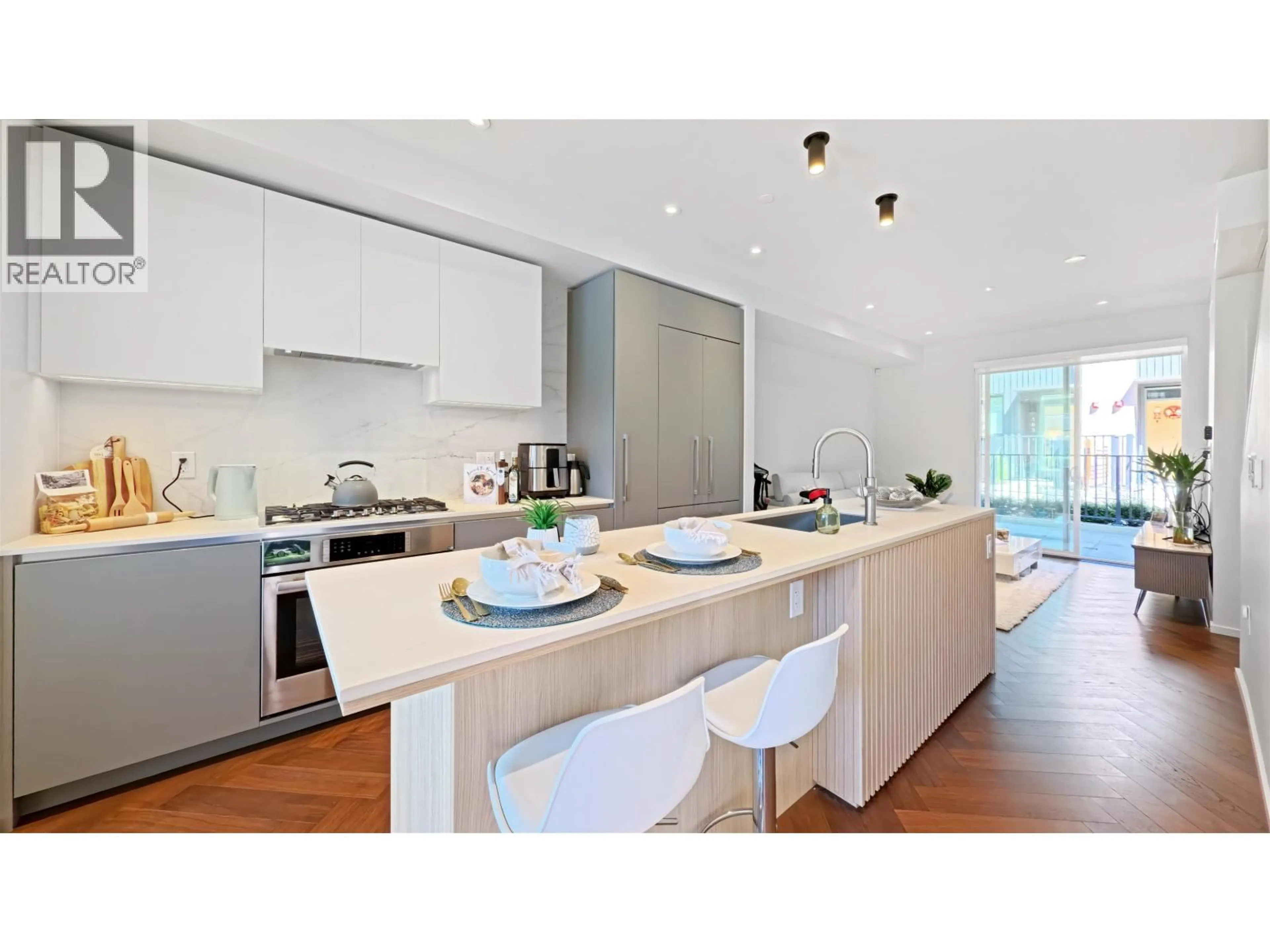 Contemporary kitchen, wood/laminate floor for 153 - 785 49TH AVENUE, Vancouver British Columbia V5Z0A1