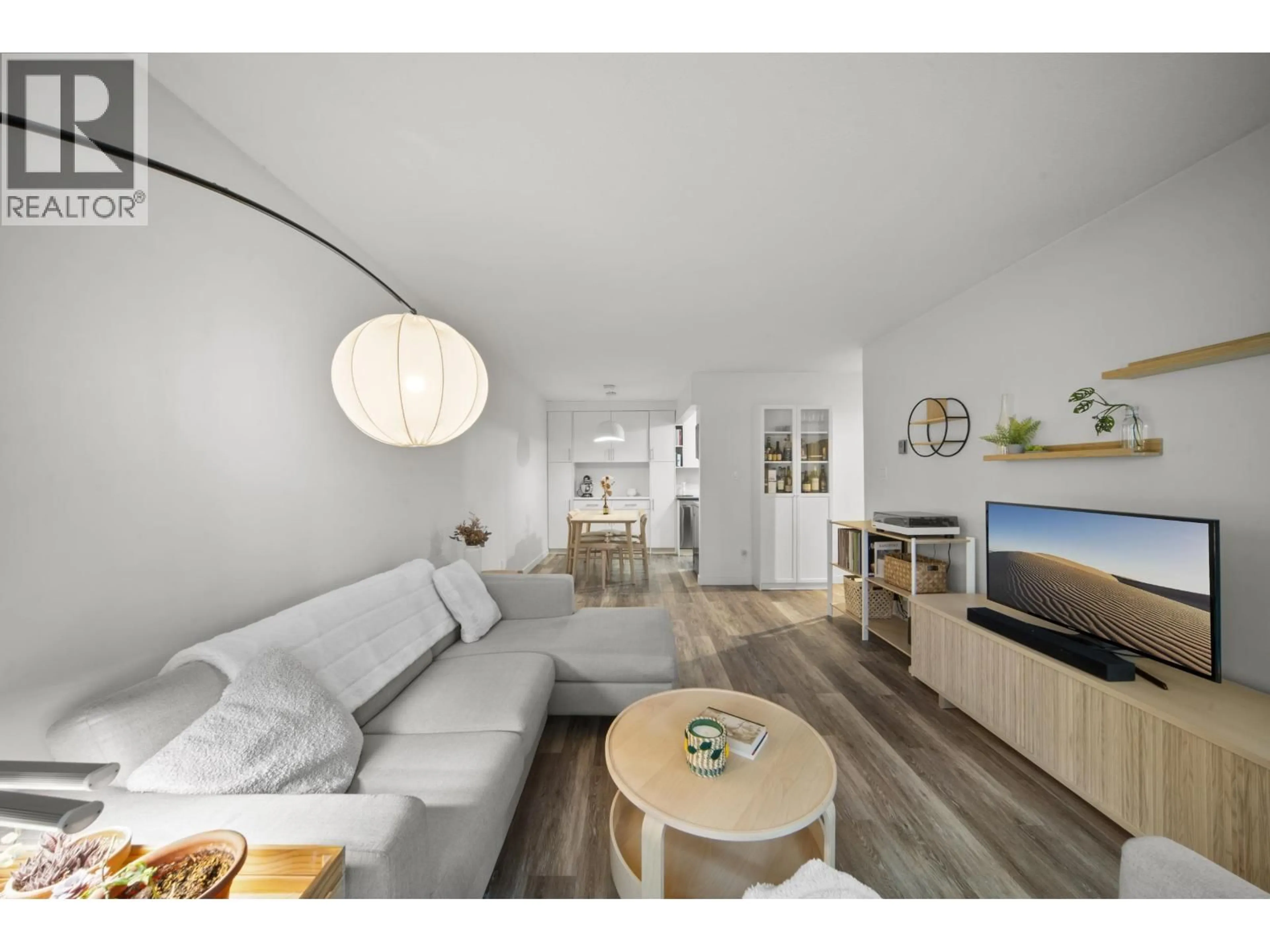 Living room with furniture, wood/laminate floor for 209 - 975 13TH AVENUE, Vancouver British Columbia V5Z1P4