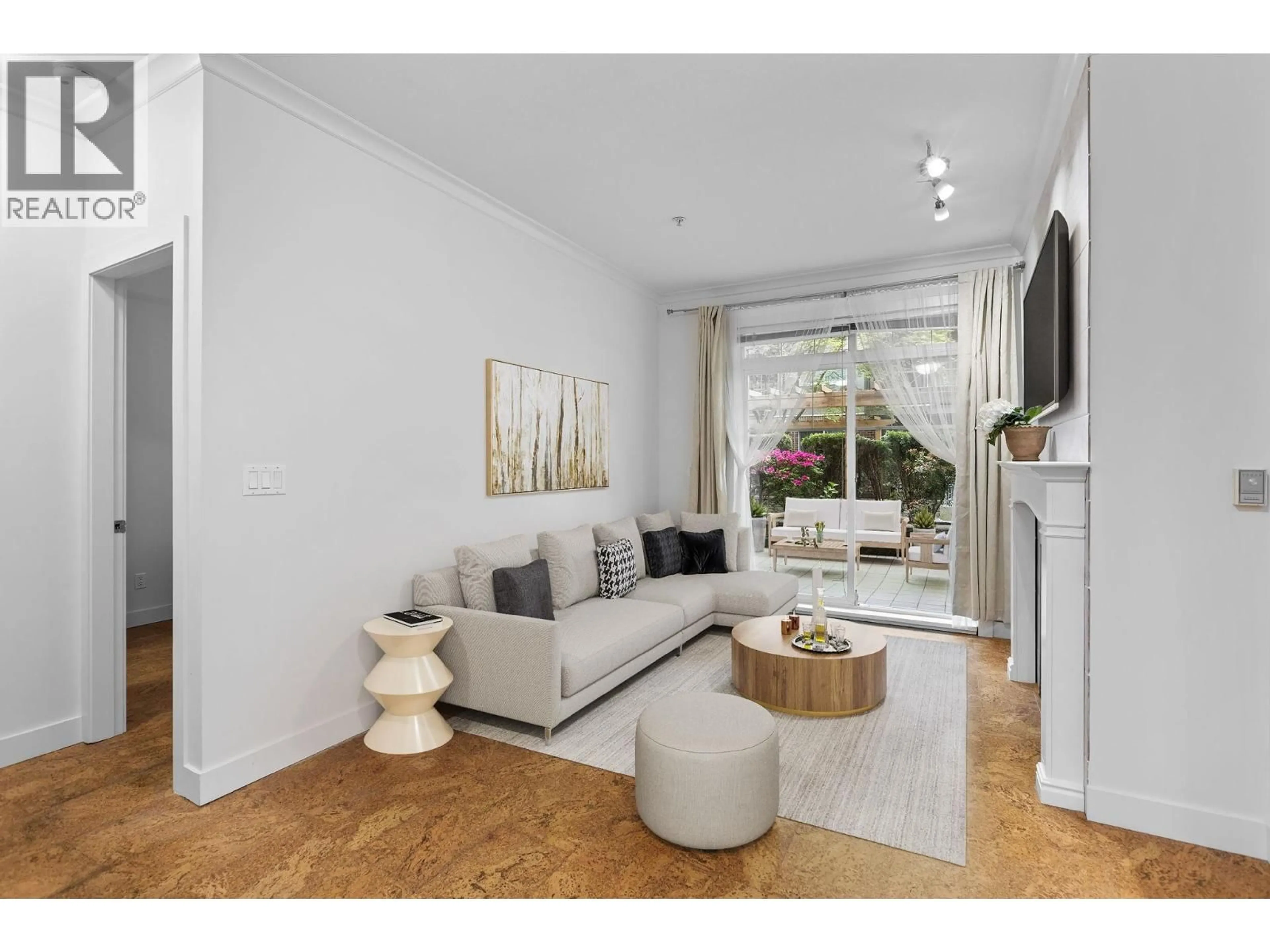 Living room with furniture, wood/laminate floor for 102 - 3250 ST JOHNS STREET, Port Moody British Columbia V3H0B1