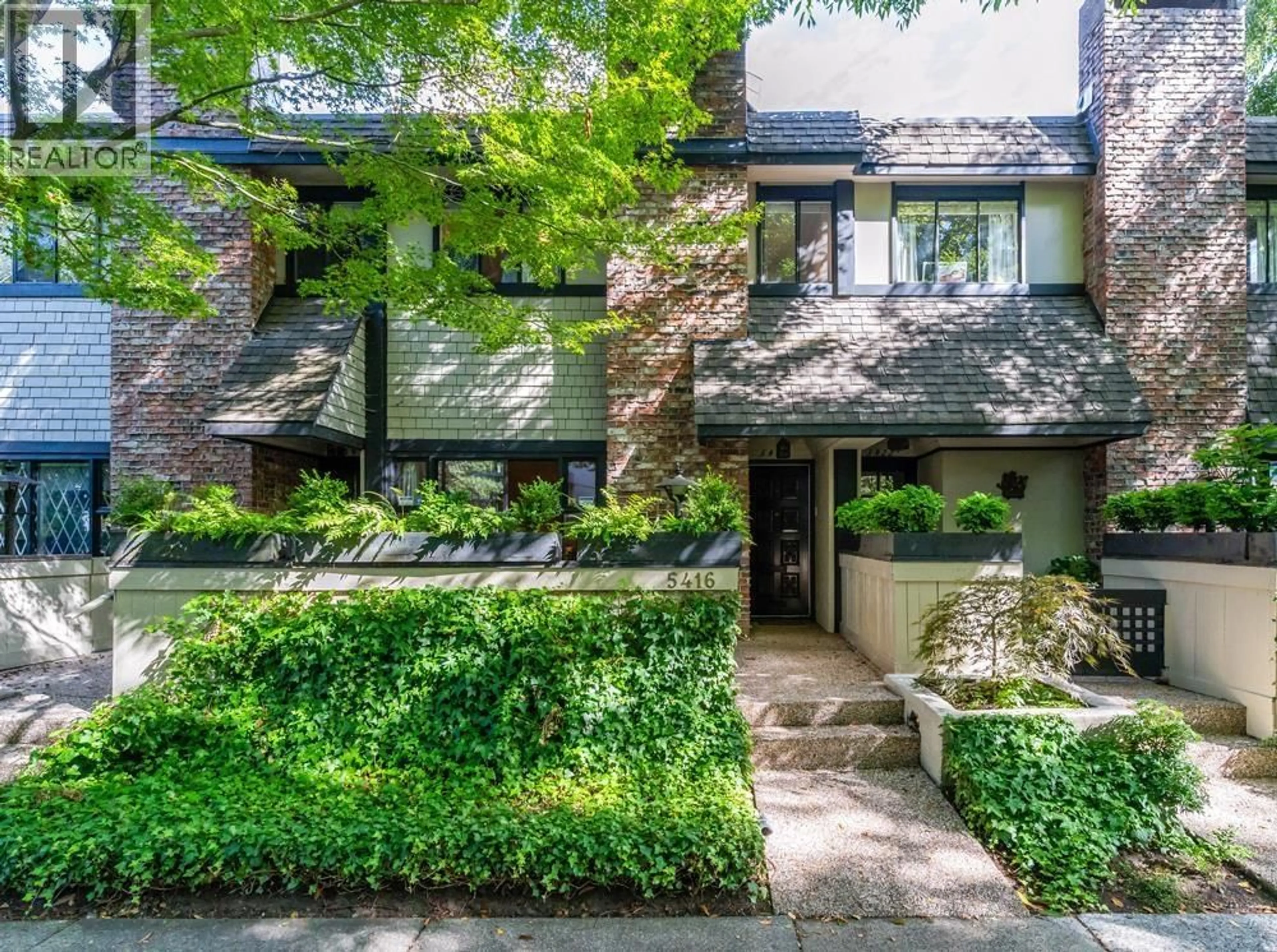 Home with brick exterior material, street for 5416 YEW STREET, Vancouver British Columbia V6M3X8