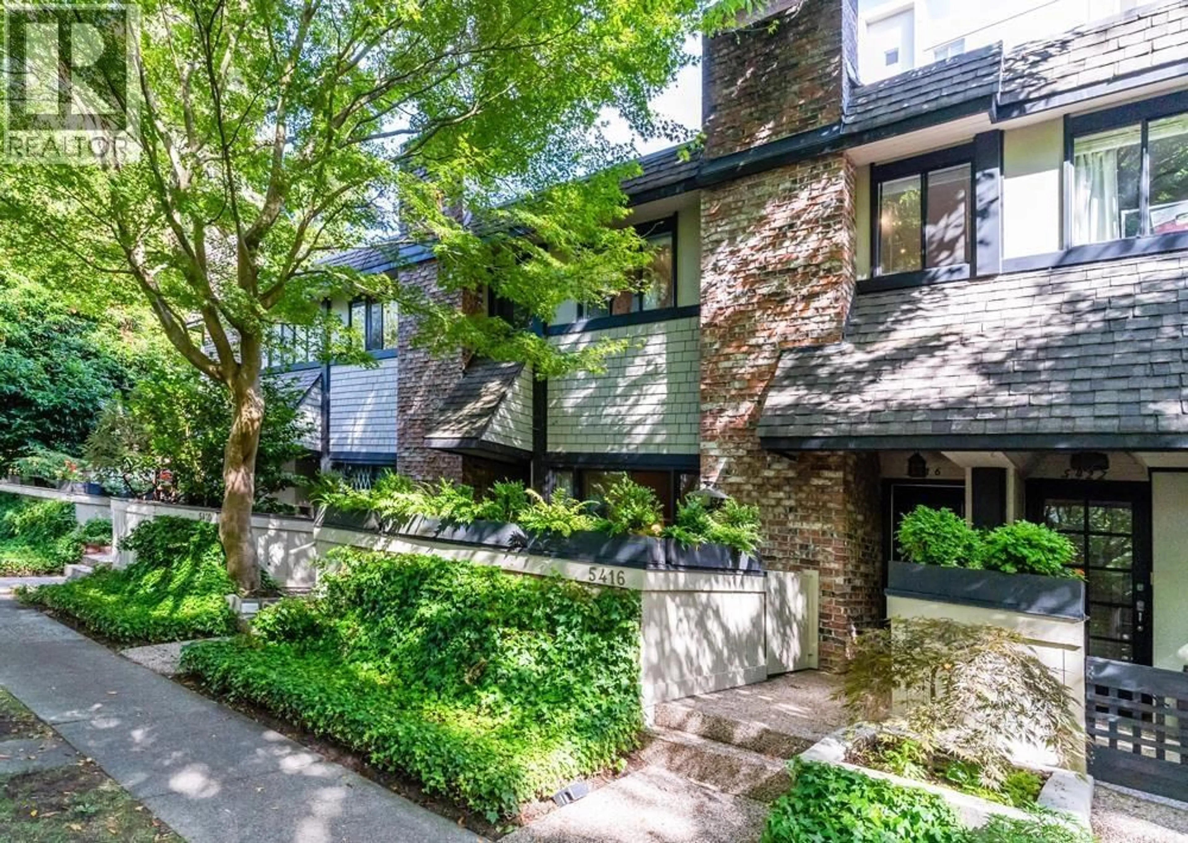Home with brick exterior material, street for 5416 YEW STREET, Vancouver British Columbia V6M3X8