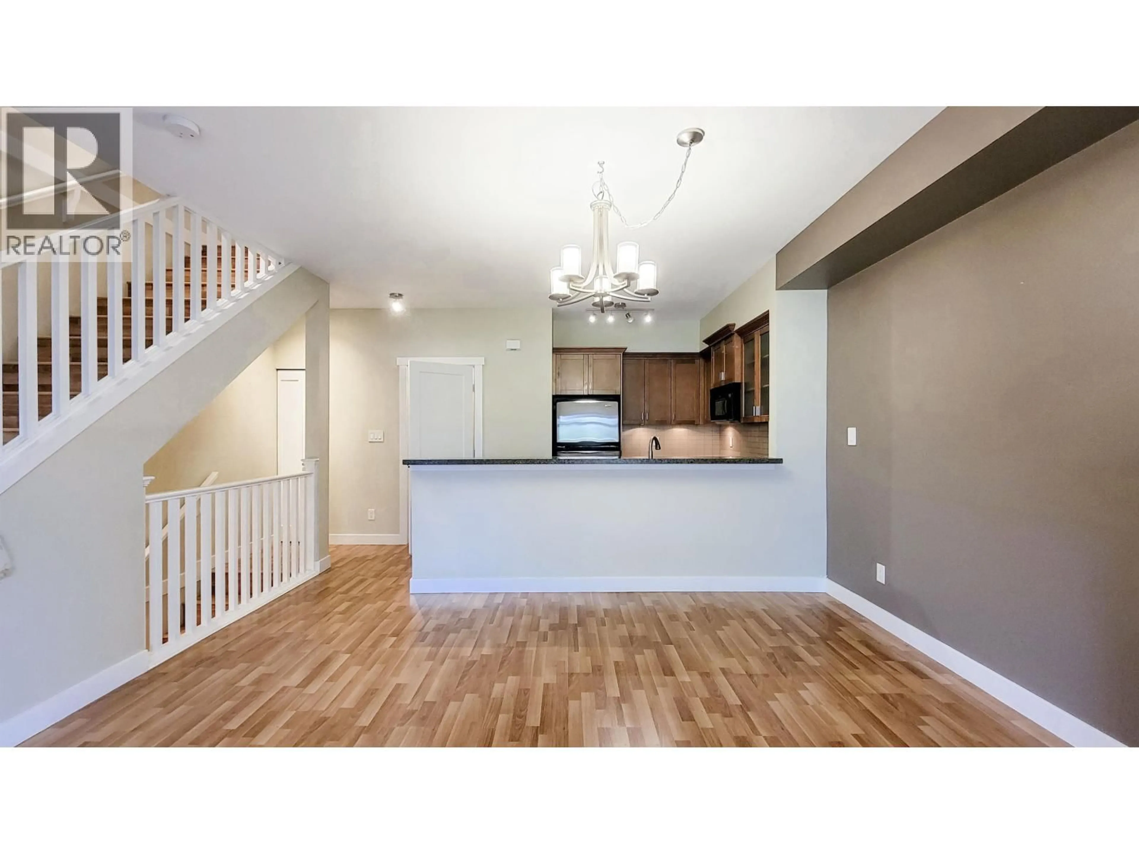 Open concept kitchen, wood/laminate floor for 74 - 7388 MACPHERSON AVENUE, Burnaby British Columbia V5J0A1