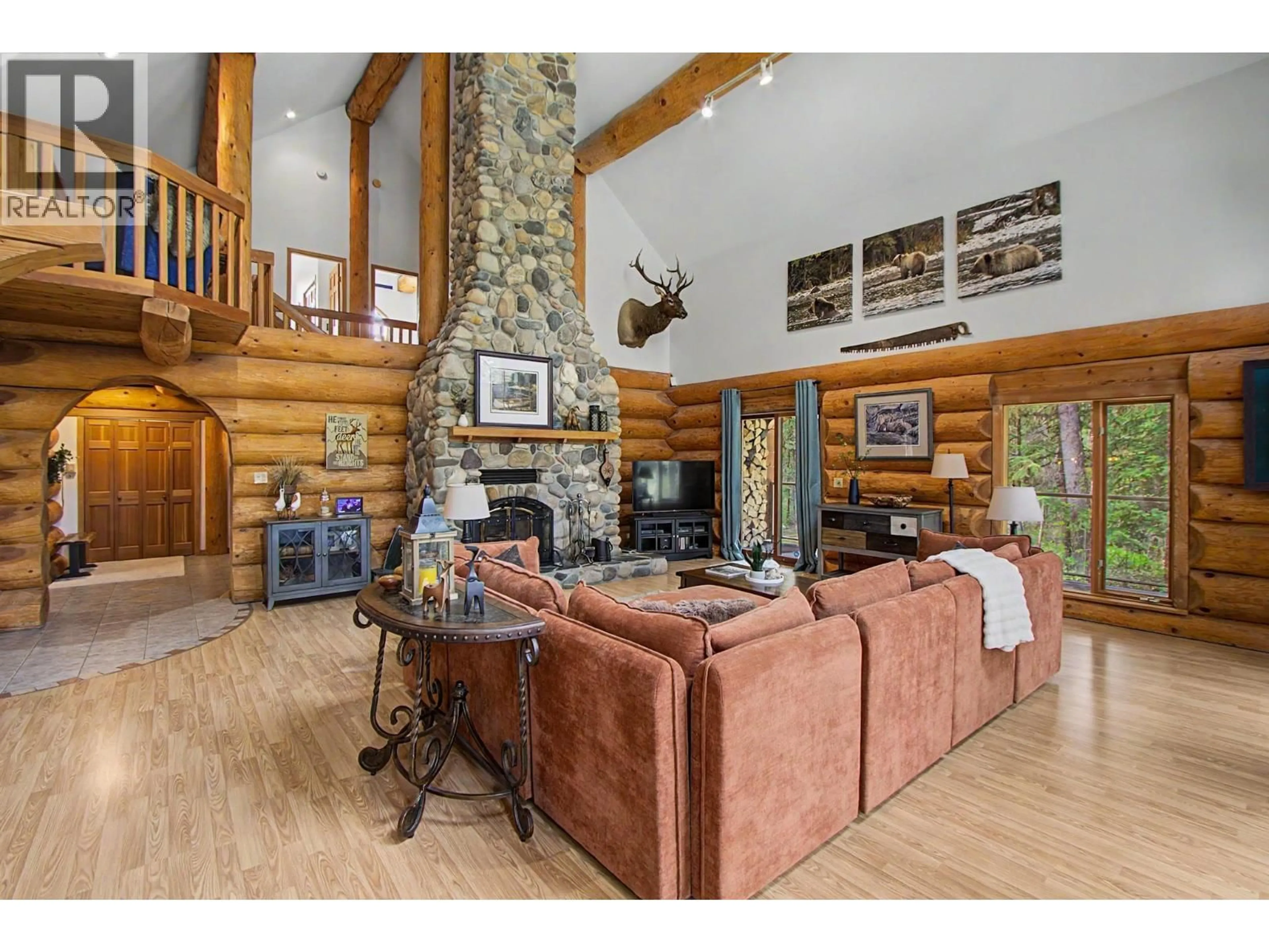 Living room with furniture, wood/laminate floor for 14350 FRANKFORD ROAD, Prince George British Columbia V2M7C1