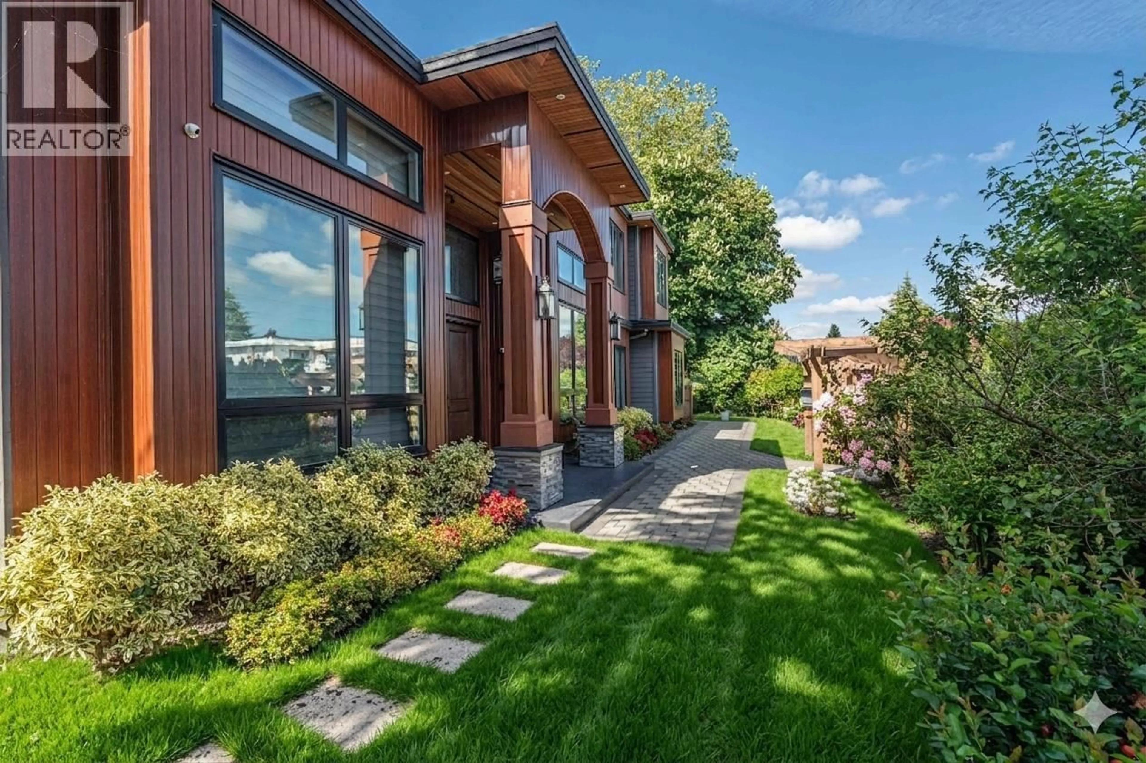 Home with brick exterior material, mountain view for 7660 MALAHAT AVENUE, Richmond British Columbia V7A4H2