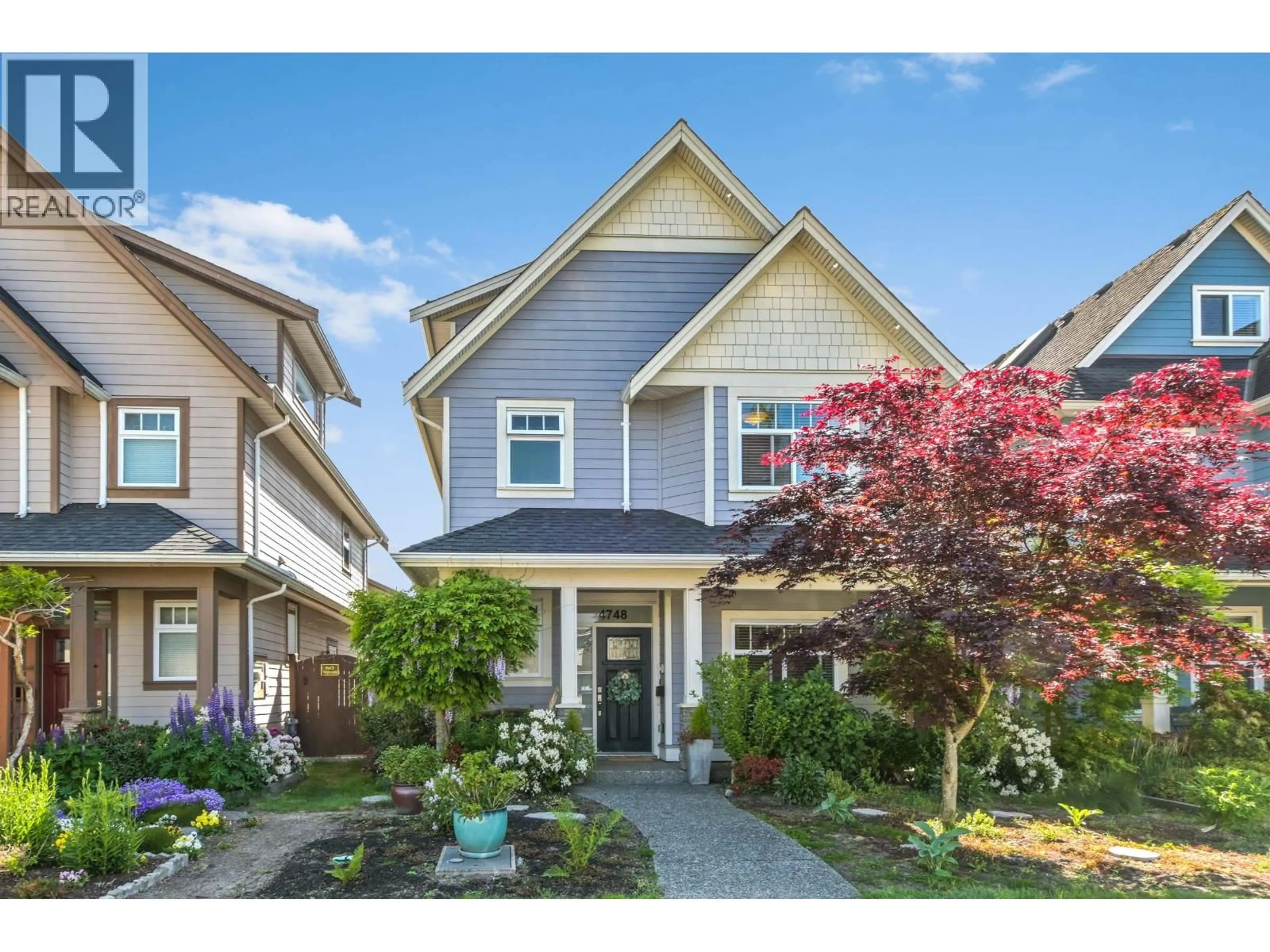 Home with vinyl exterior material, street for 4748A 55B STREET, Ladner British Columbia V4K3B7