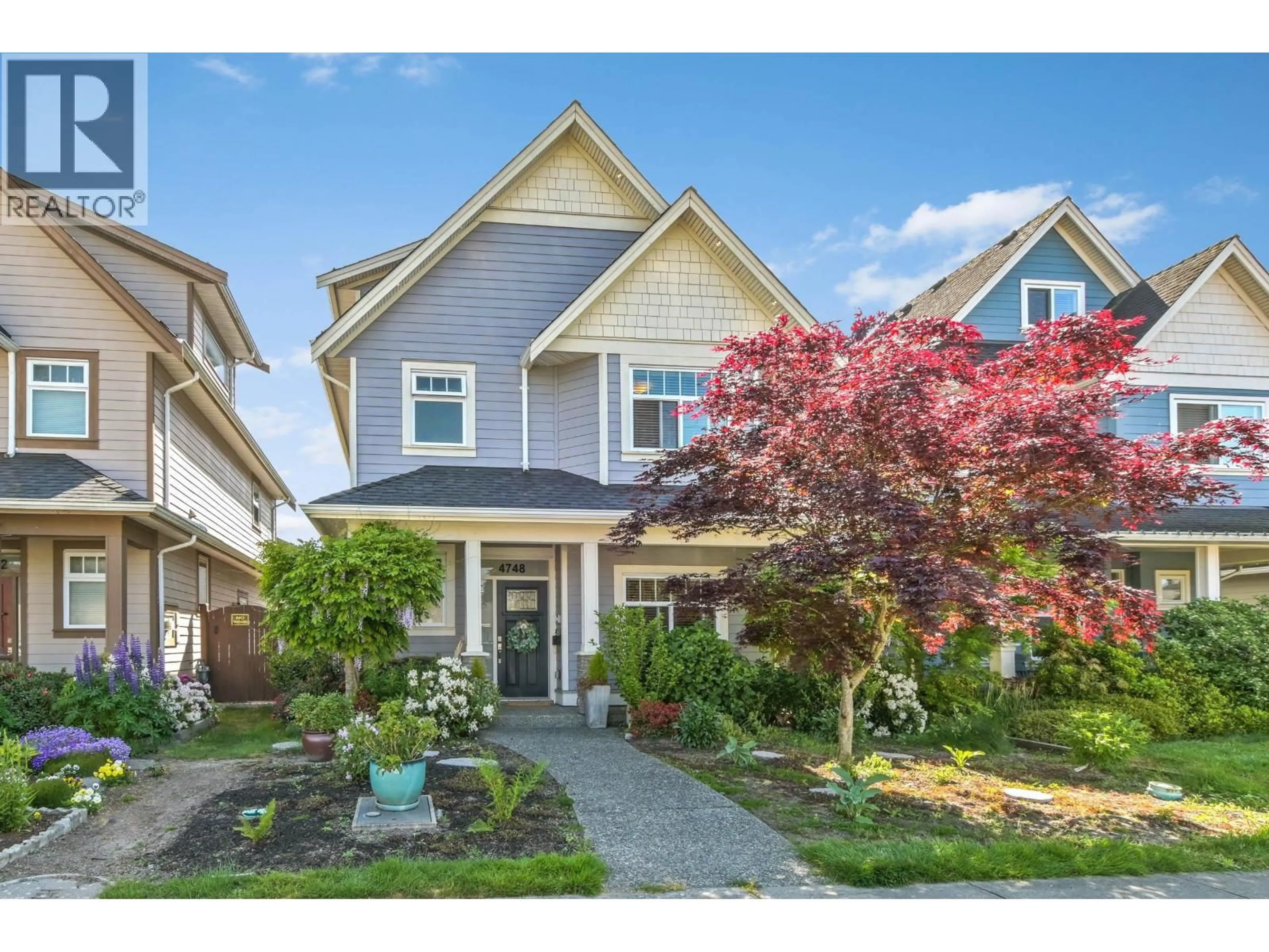 Home with vinyl exterior material, street for 4748A 55B STREET, Ladner British Columbia V4K3B7
