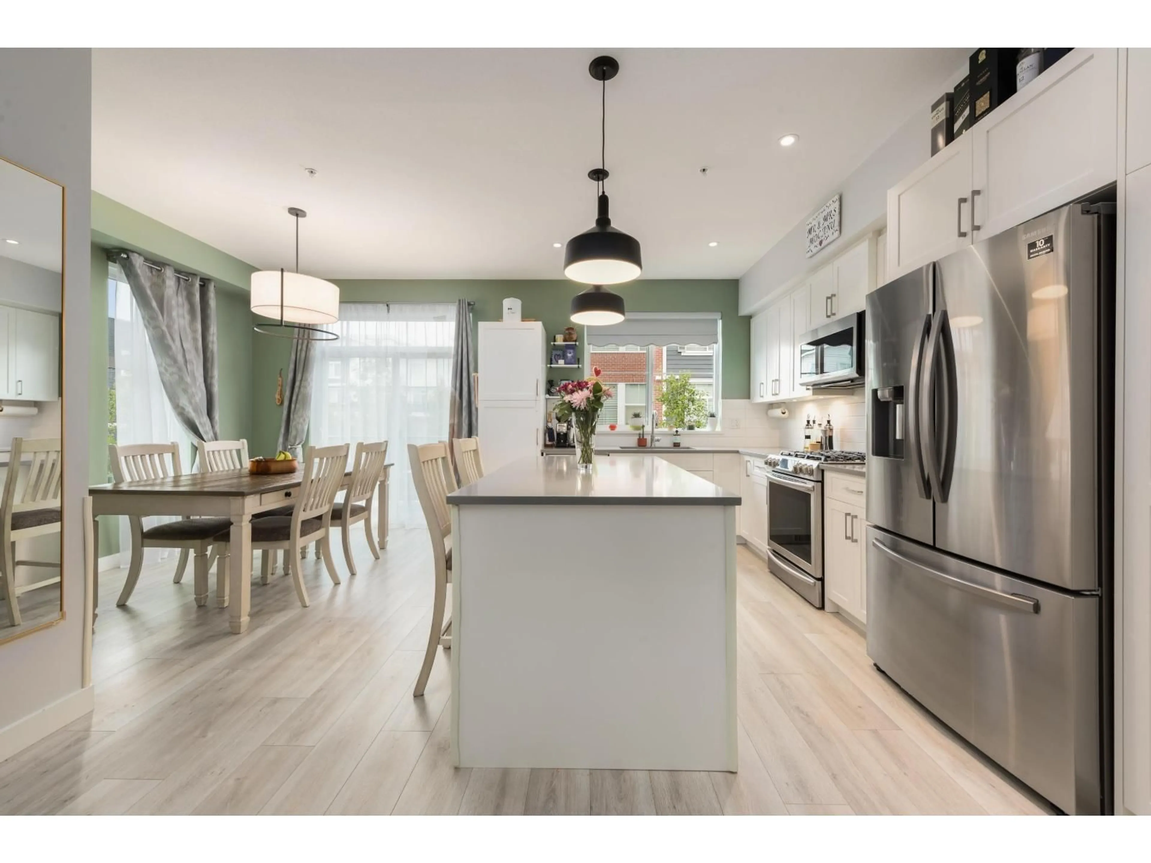 Open concept kitchen, wood/laminate floor for 52 - 8371 202B STREET, Langley British Columbia V2Y4K6