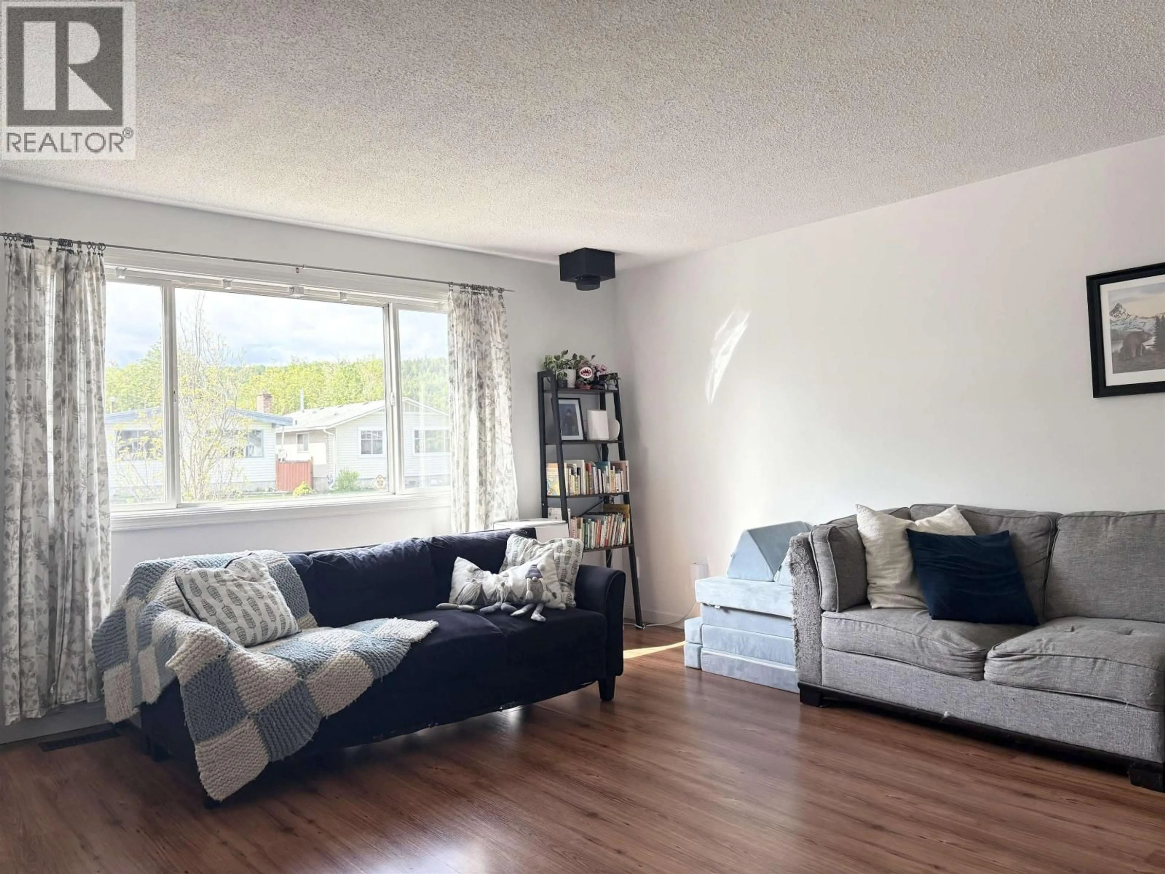 Living room with furniture, wood/laminate floor for 1162 HANSARD CRESCENT, Prince George British Columbia V2N4K2