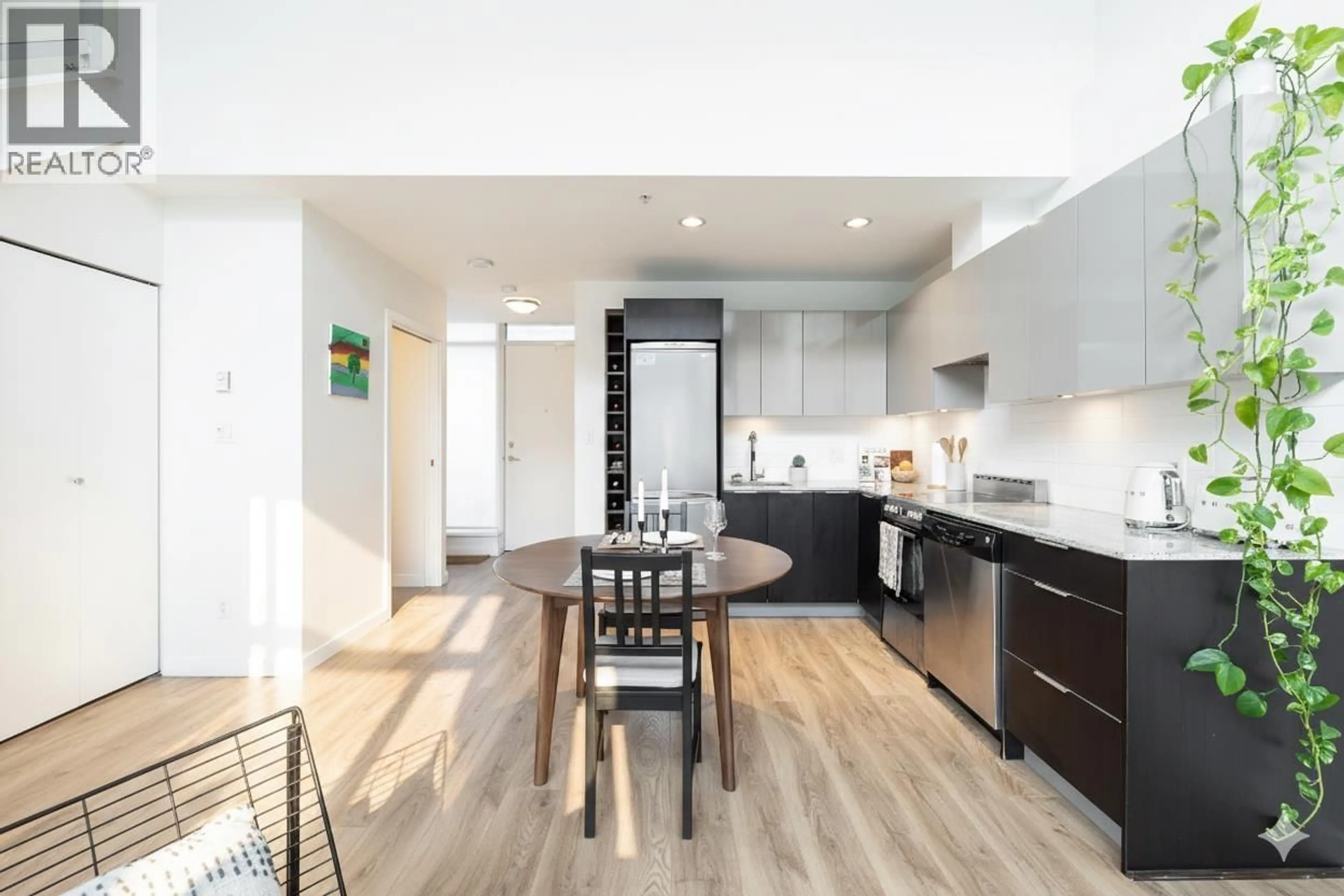 Open concept kitchen, wood/laminate floor for 310 - 429 2ND AVENUE, Vancouver British Columbia V5Y1E3