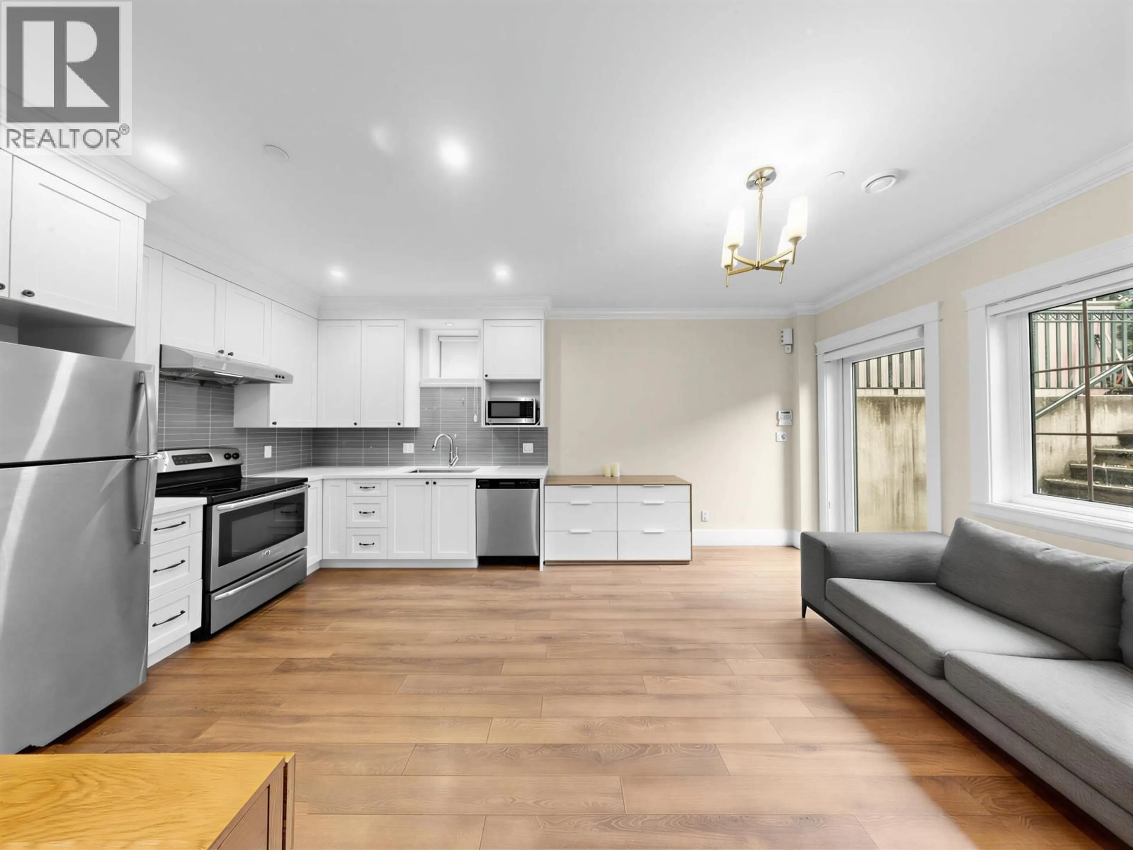 Open concept kitchen, wood/laminate floor for 3393 27TH AVENUE, Vancouver British Columbia V6S1P5