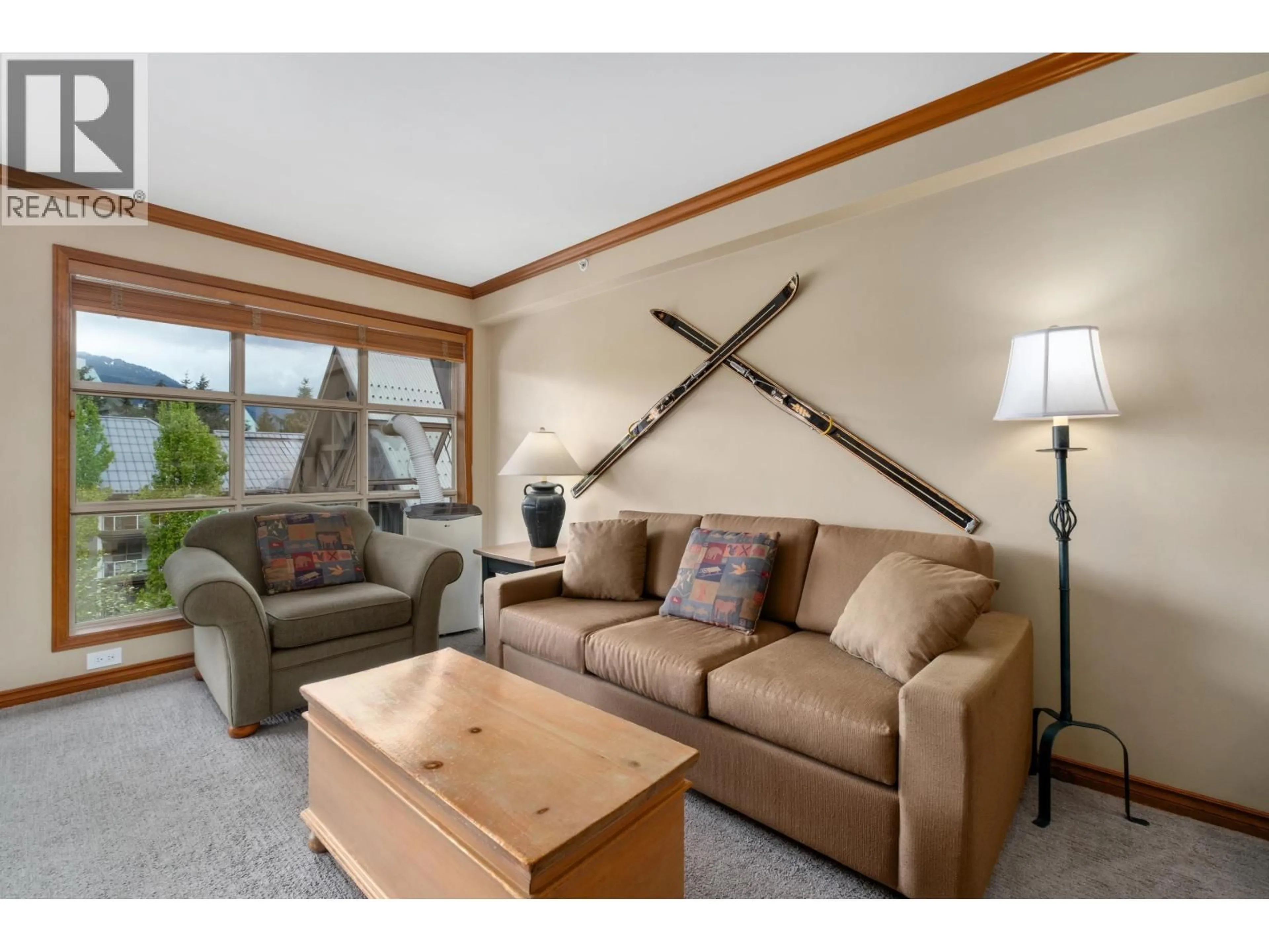 Living room with furniture, wood/laminate floor for 562 - 4800 SPEARHEAD DRIVE, Whistler British Columbia V8E1G1