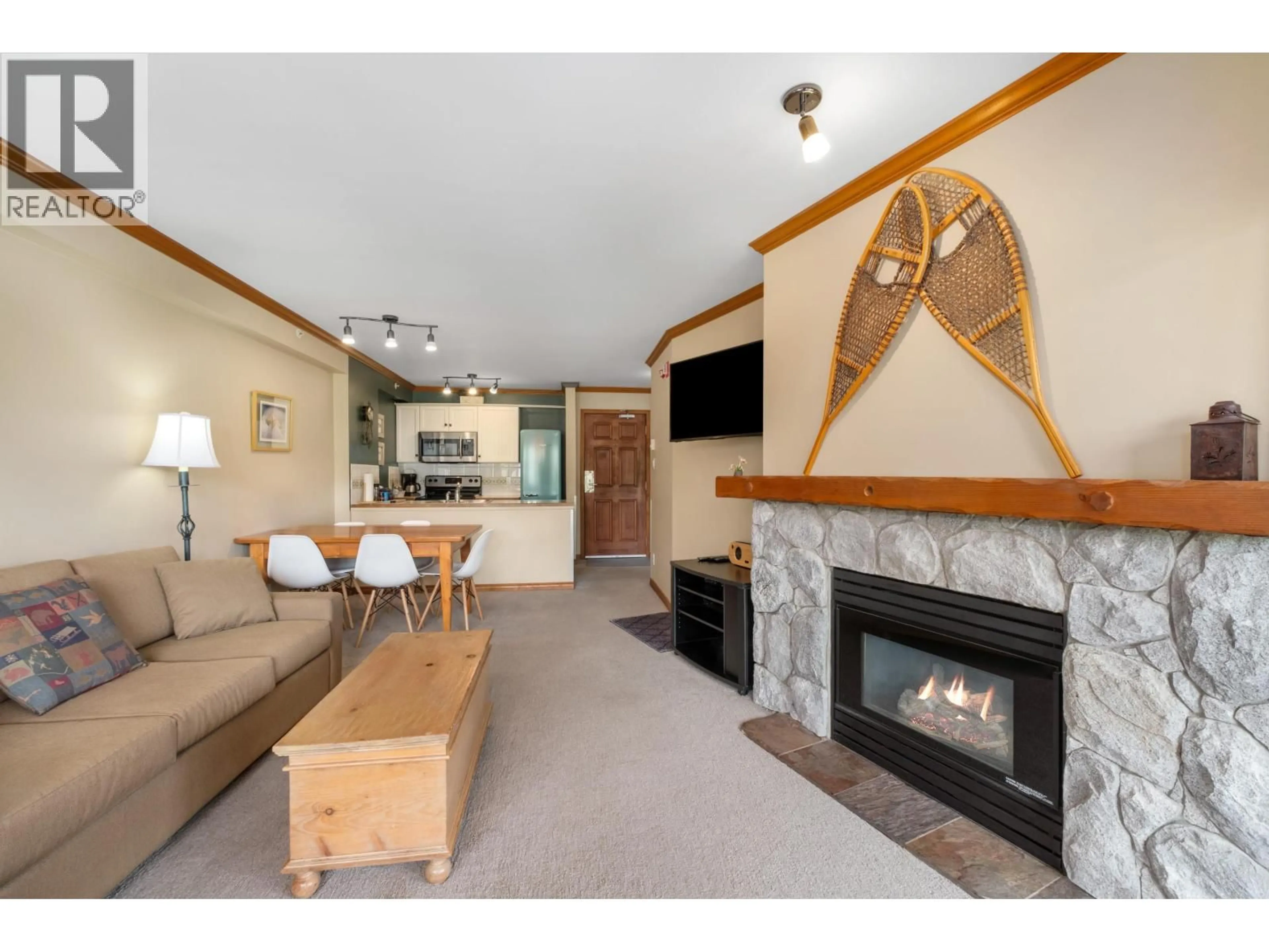 Living room with furniture, wood/laminate floor for 562 - 4800 SPEARHEAD DRIVE, Whistler British Columbia V8E1G1