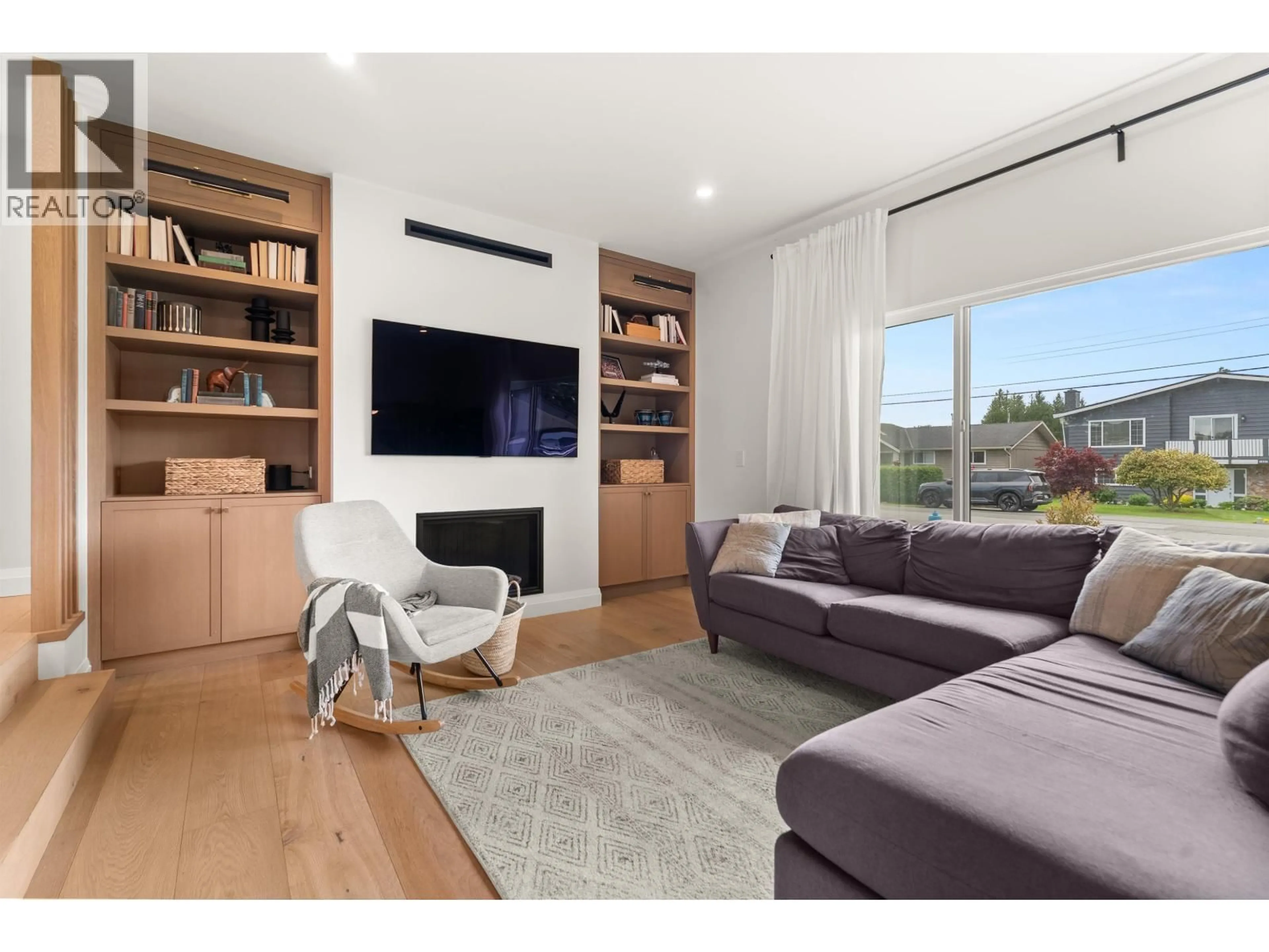 Living room with furniture, wood/laminate floor for 4894 58 STREET, Delta British Columbia V4K3H5
