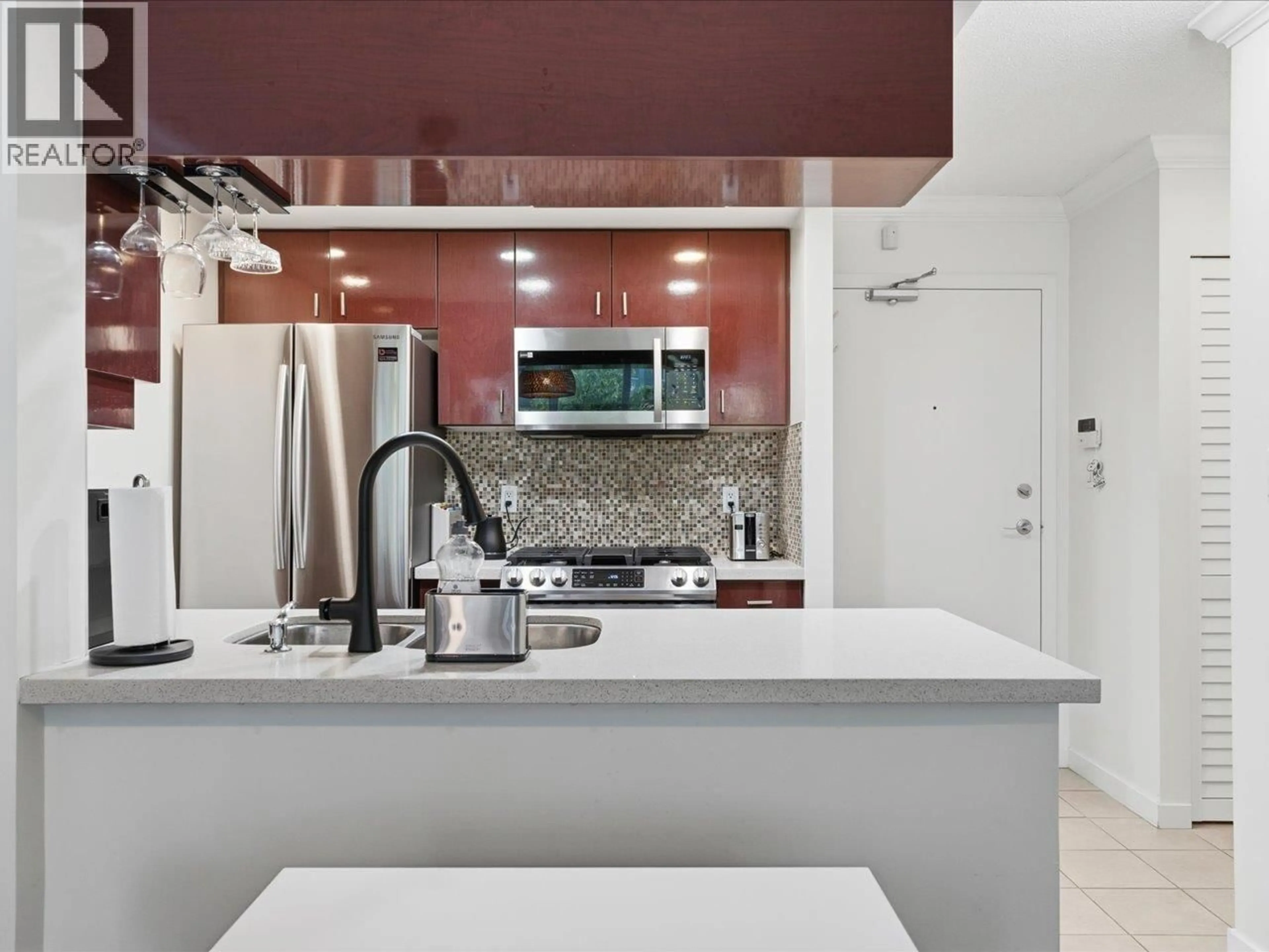 Contemporary kitchen, ceramic/tile floor for 502 - 1033 MARINASIDE CRESCENT, Vancouver British Columbia V6Z3A3