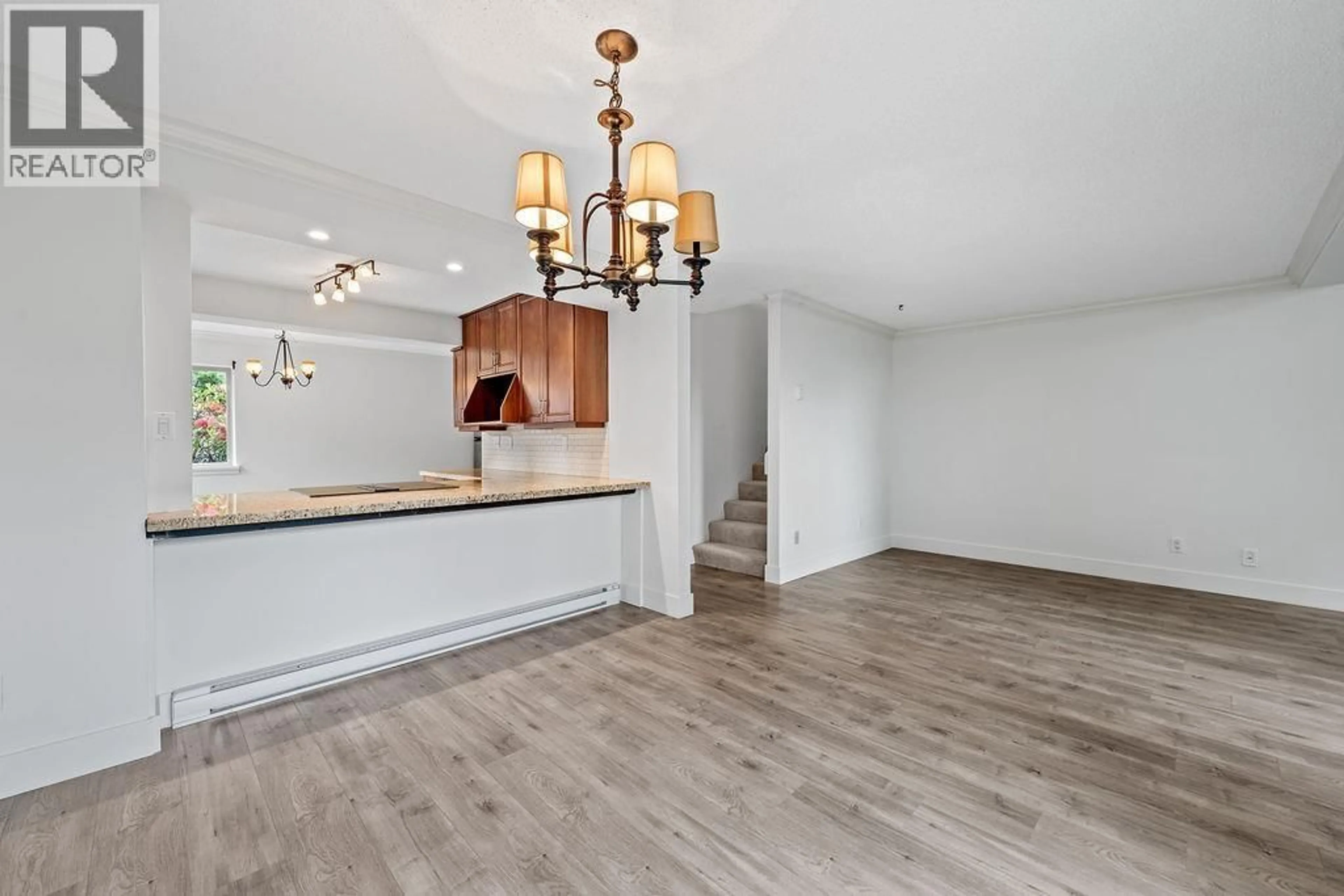Open concept kitchen, wood/laminate floor for 94 - 6880 LUCAS ROAD, Richmond British Columbia V7C4T8