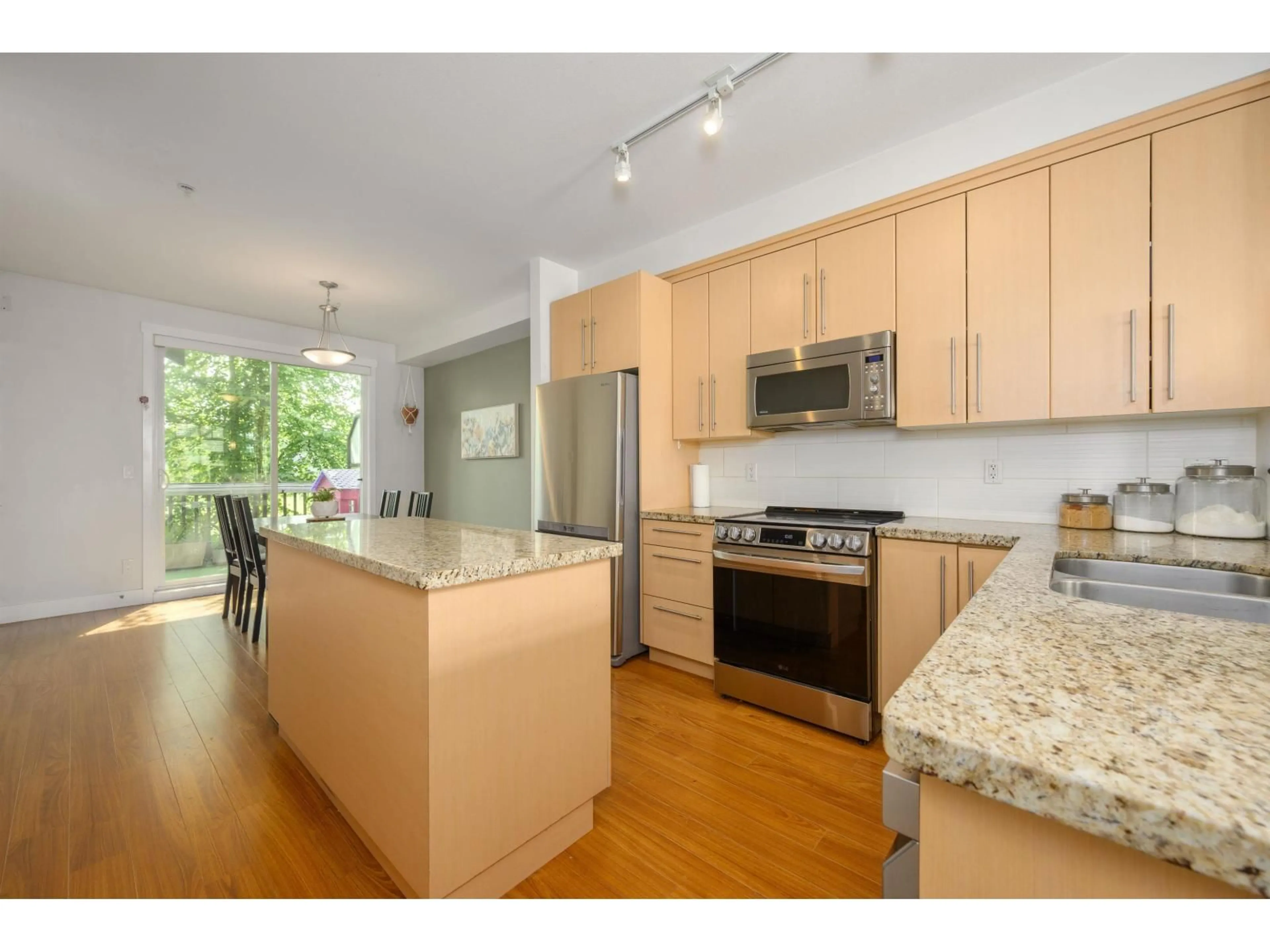 Open concept kitchen, wood/laminate floor for 67 - 8250 209B STREET, Langley British Columbia V2Y0J7