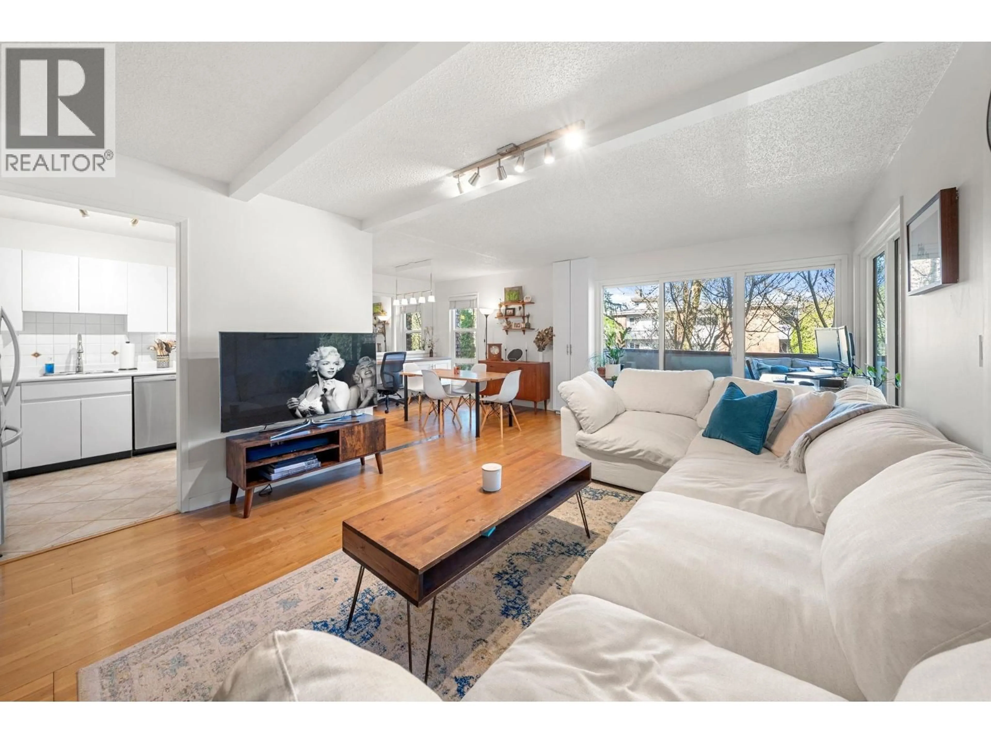 Living room with furniture, wood/laminate floor for 208 - 1266 13TH AVENUE, Vancouver British Columbia V6H1N6