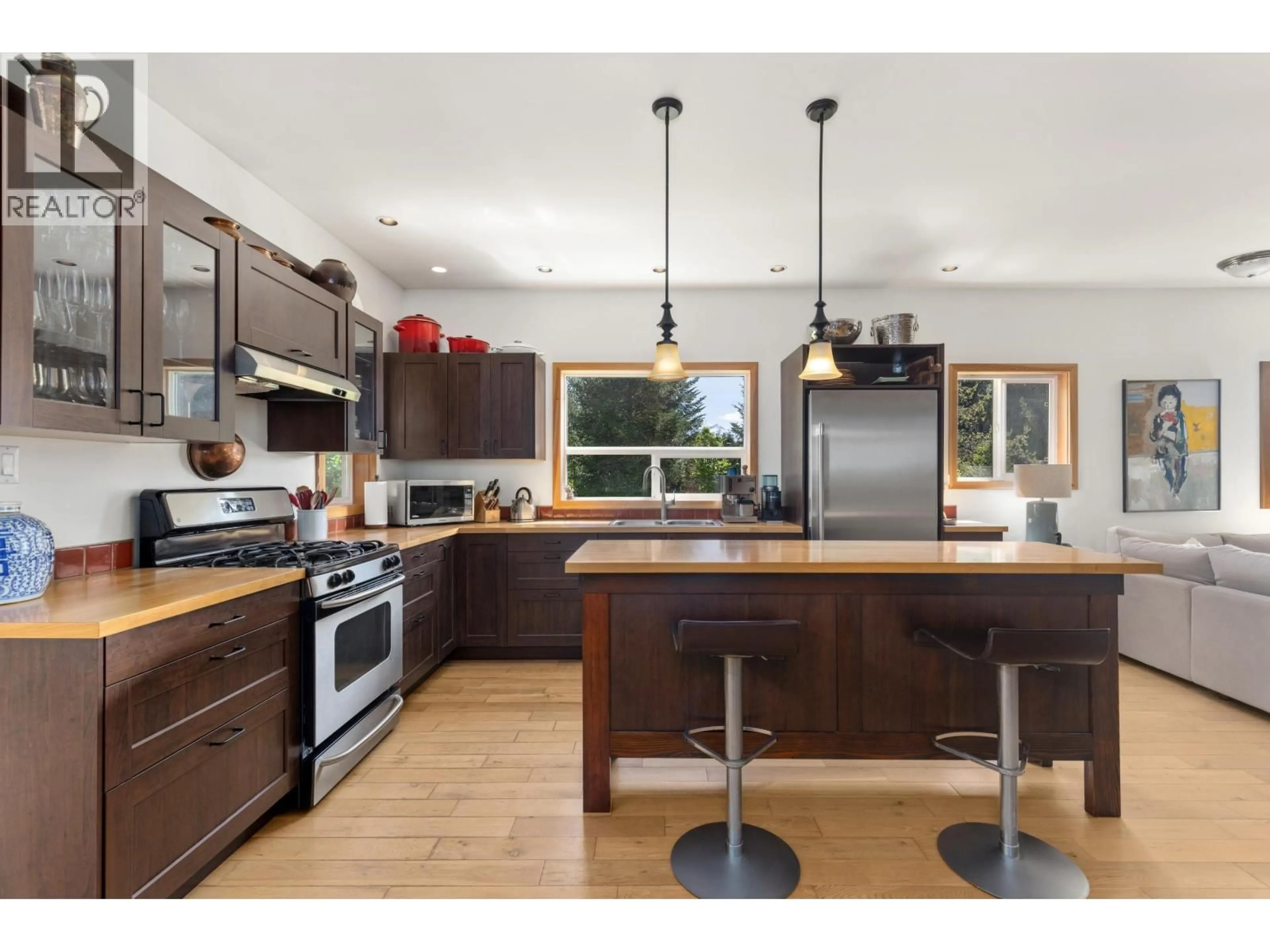 Open concept kitchen, wood/laminate floor for 8950 PEMBERTON MEADOWS ROAD, Pemberton British Columbia V0N2L2