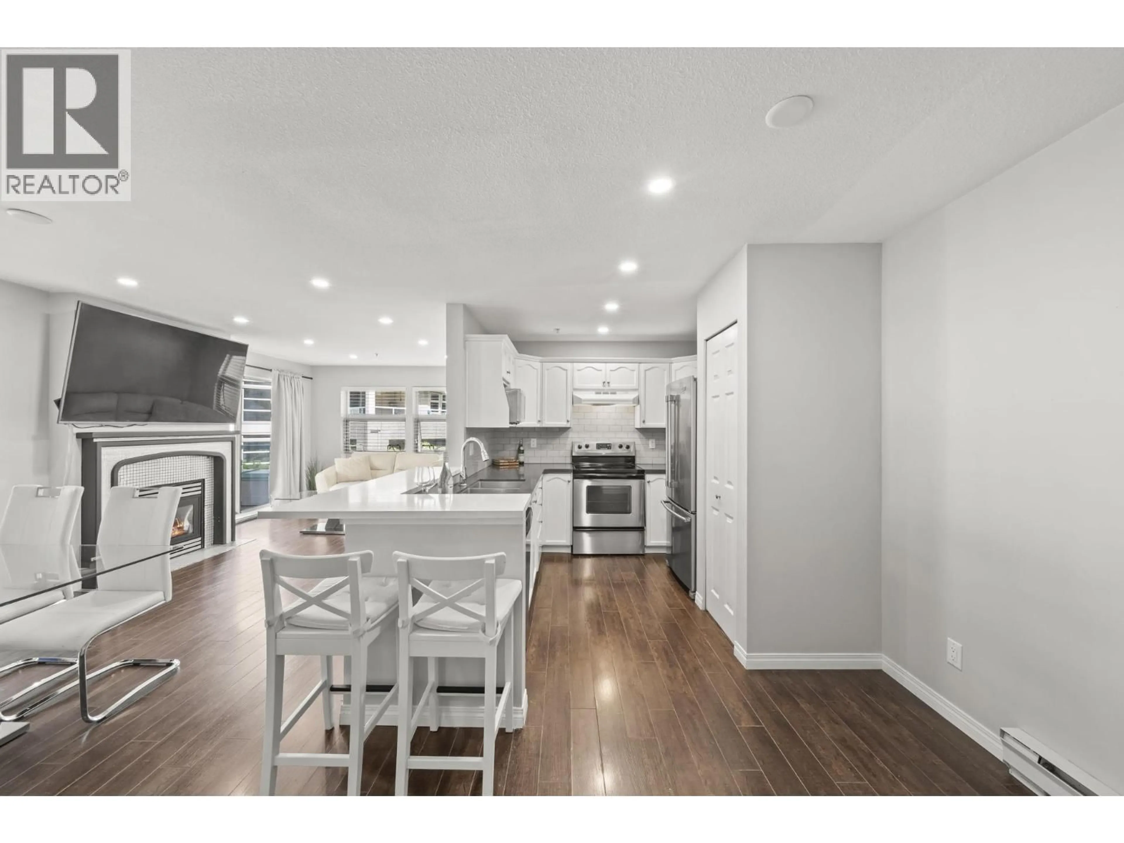 Open concept kitchen, wood/laminate floor for 506 - 301 MAUDE ROAD, Port Moody British Columbia V3H5B1