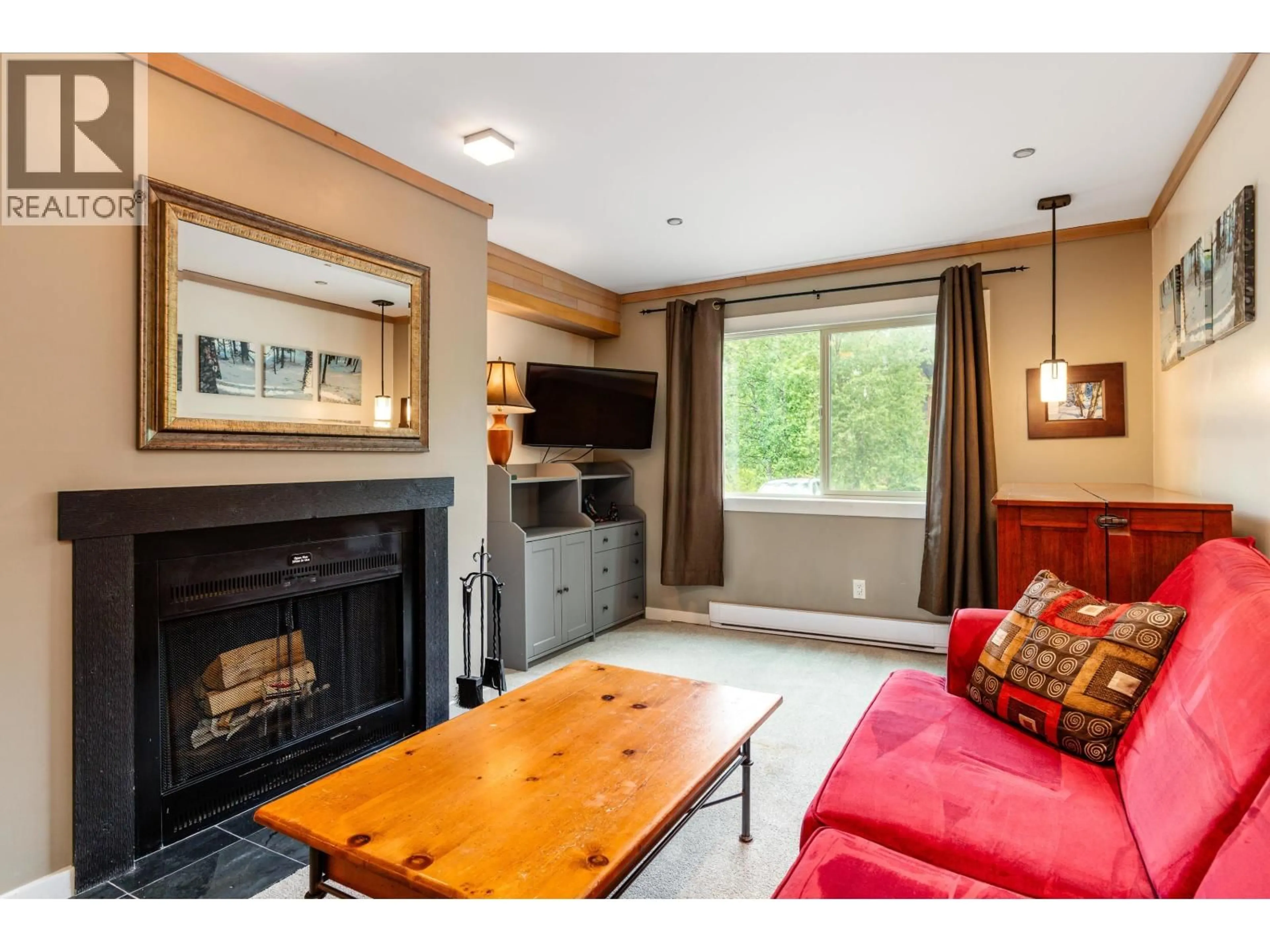 Living room with furniture, wood/laminate floor for 105 - 2021 KAREN CRESCENT, Whistler British Columbia V8E0H1