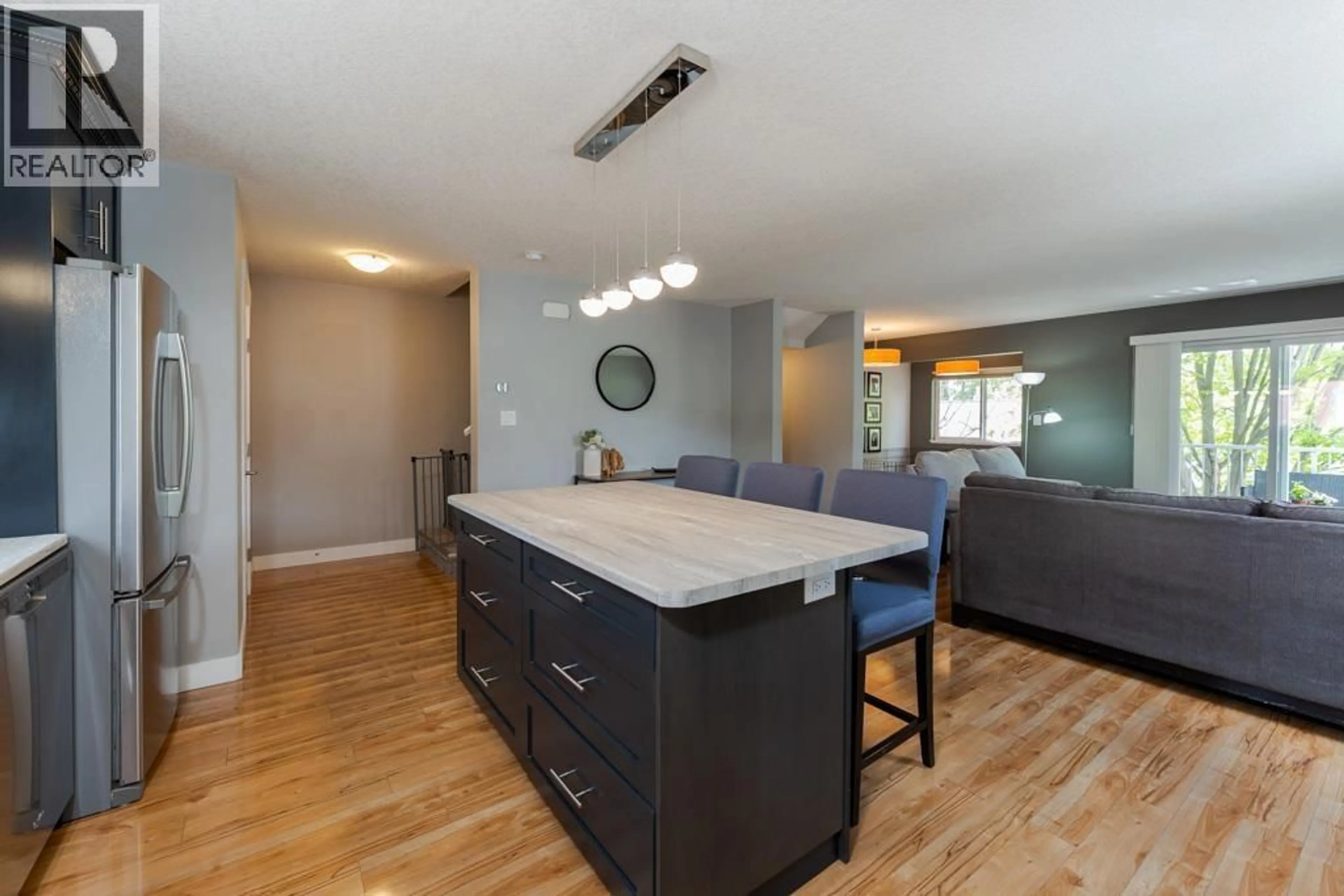 Open concept kitchen, wood/laminate floor for 104 - 1693 7TH AVENUE, Prince George British Columbia V2L0C1