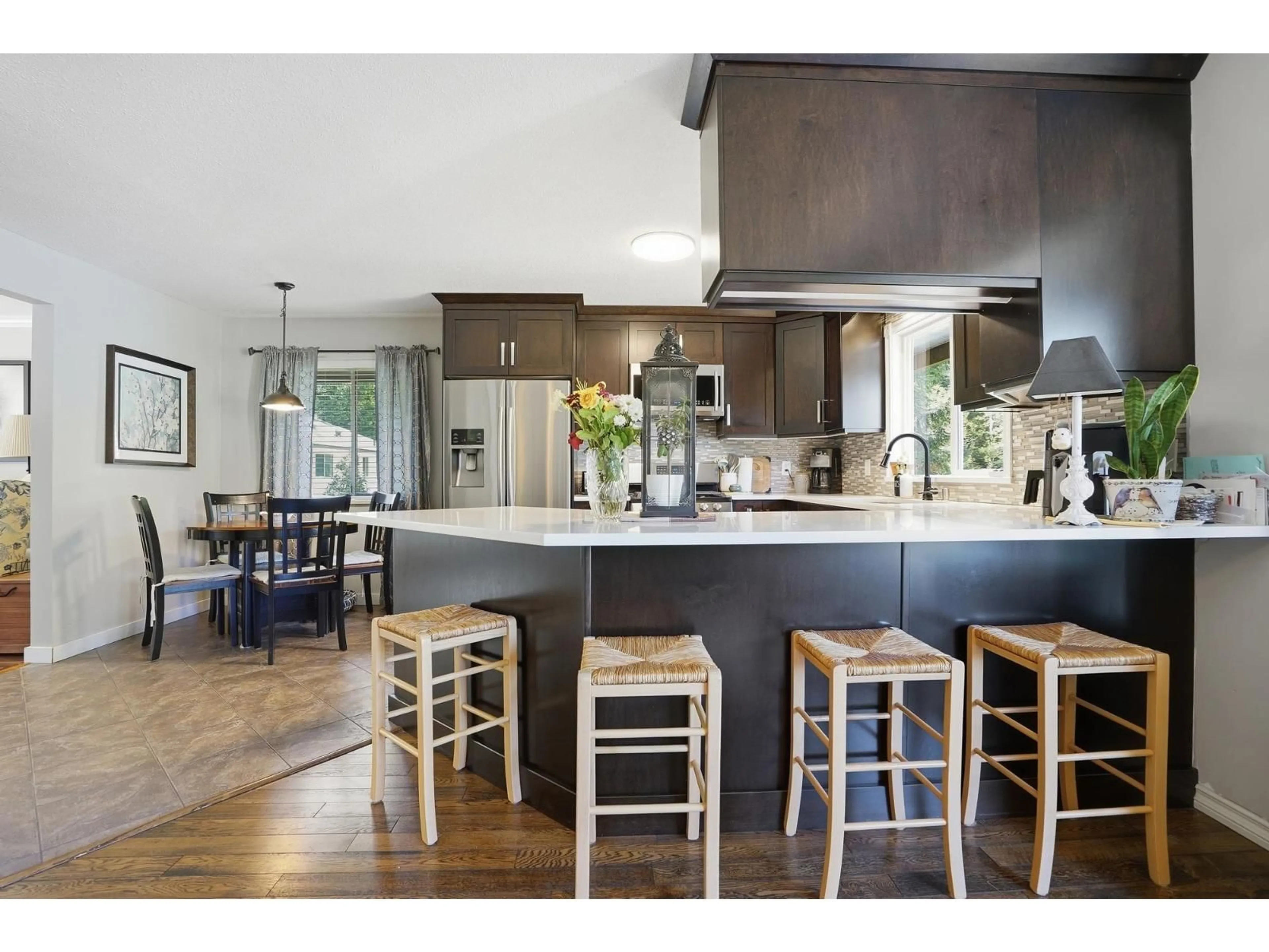 Open concept kitchen, wood/laminate floor for 8953 HAMMOND STREET, Mission British Columbia V2V6X8