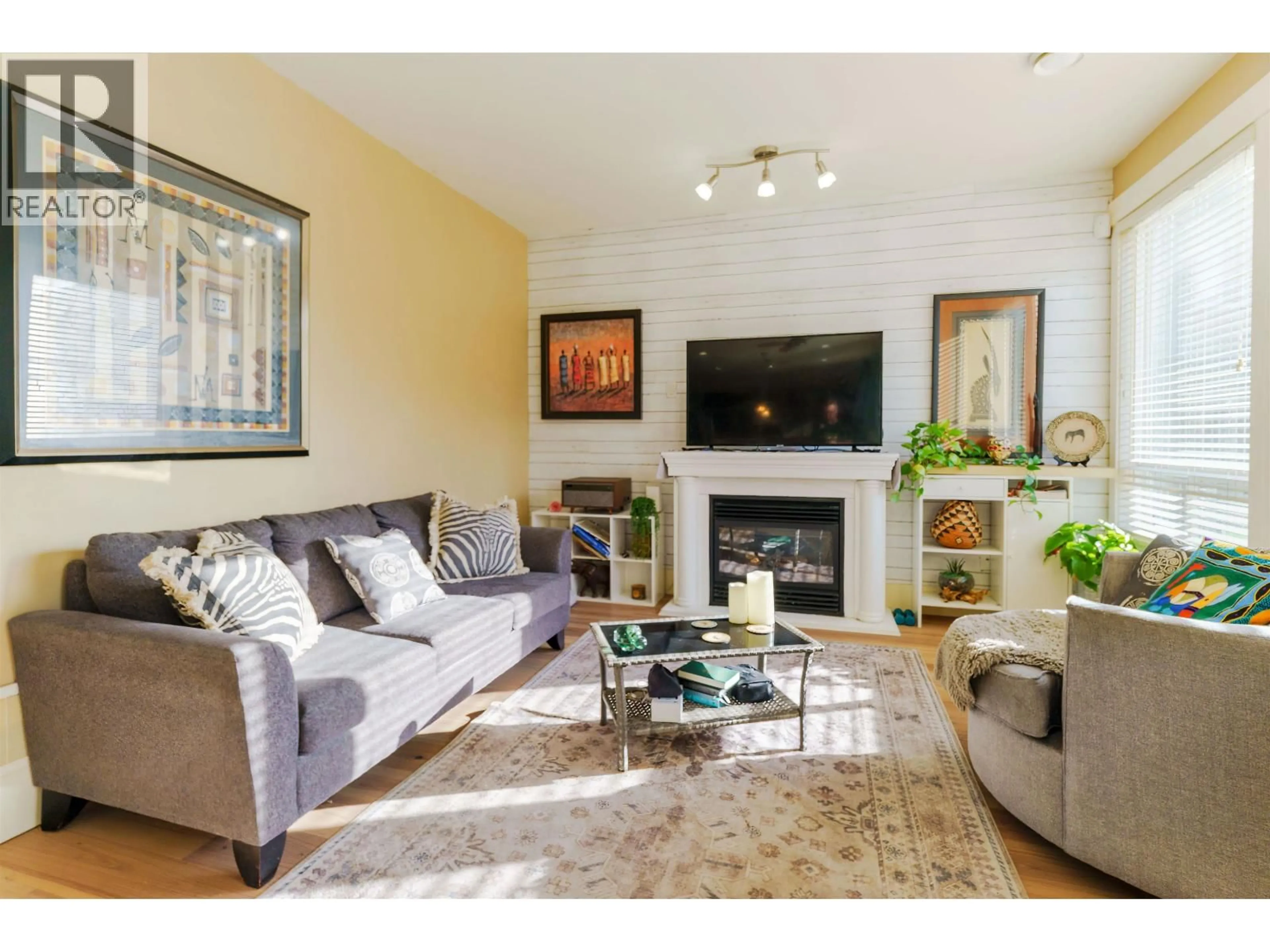 Living room with furniture, wood/laminate floor for 11125 234A STREET, Maple Ridge British Columbia V2W0B7