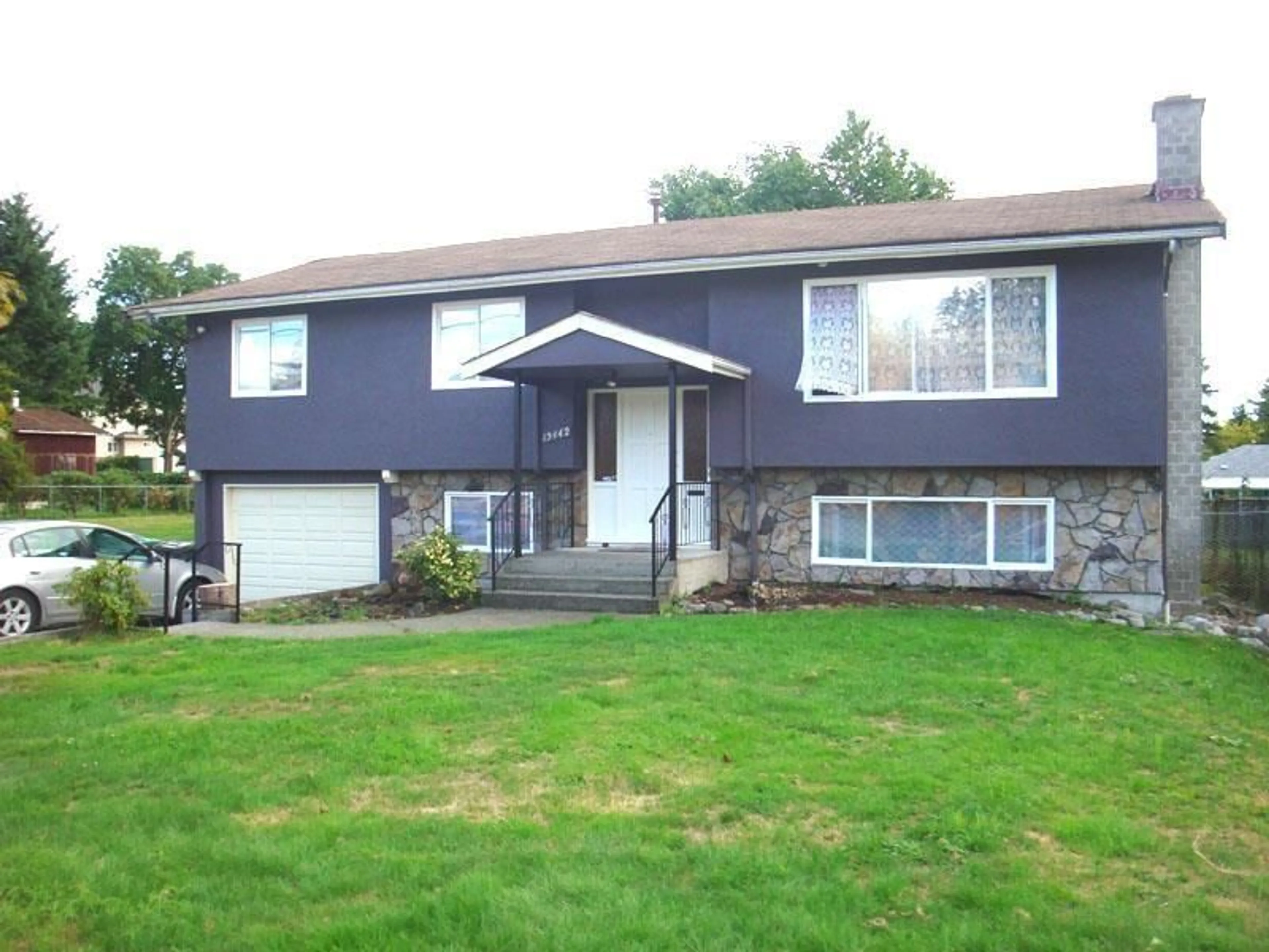 Home with vinyl exterior material, street for 13442 98A AVENUE, Surrey British Columbia V3T1C8