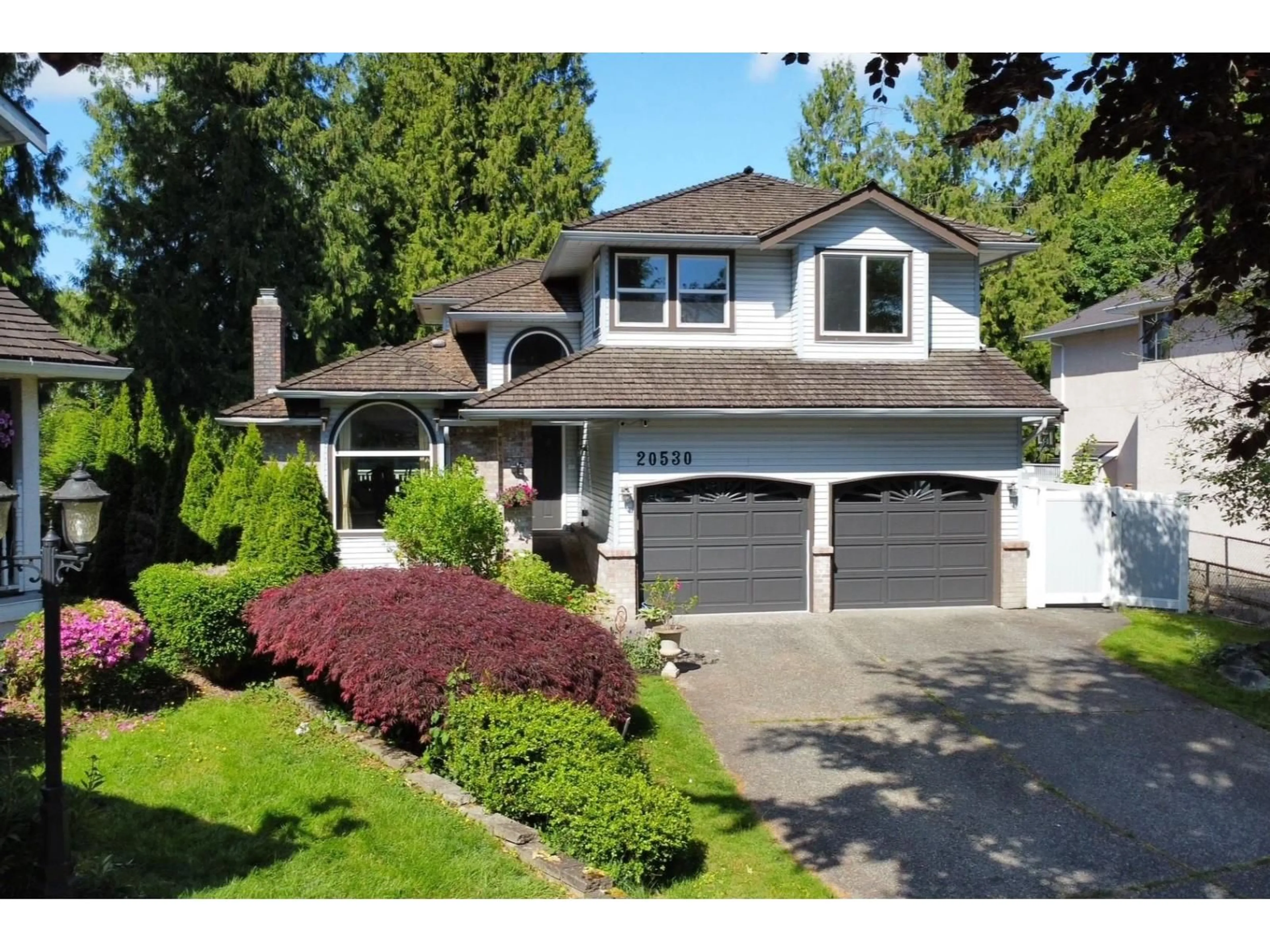 Home with vinyl exterior material, street for 20530 96B AVENUE, Langley British Columbia V1M2H4
