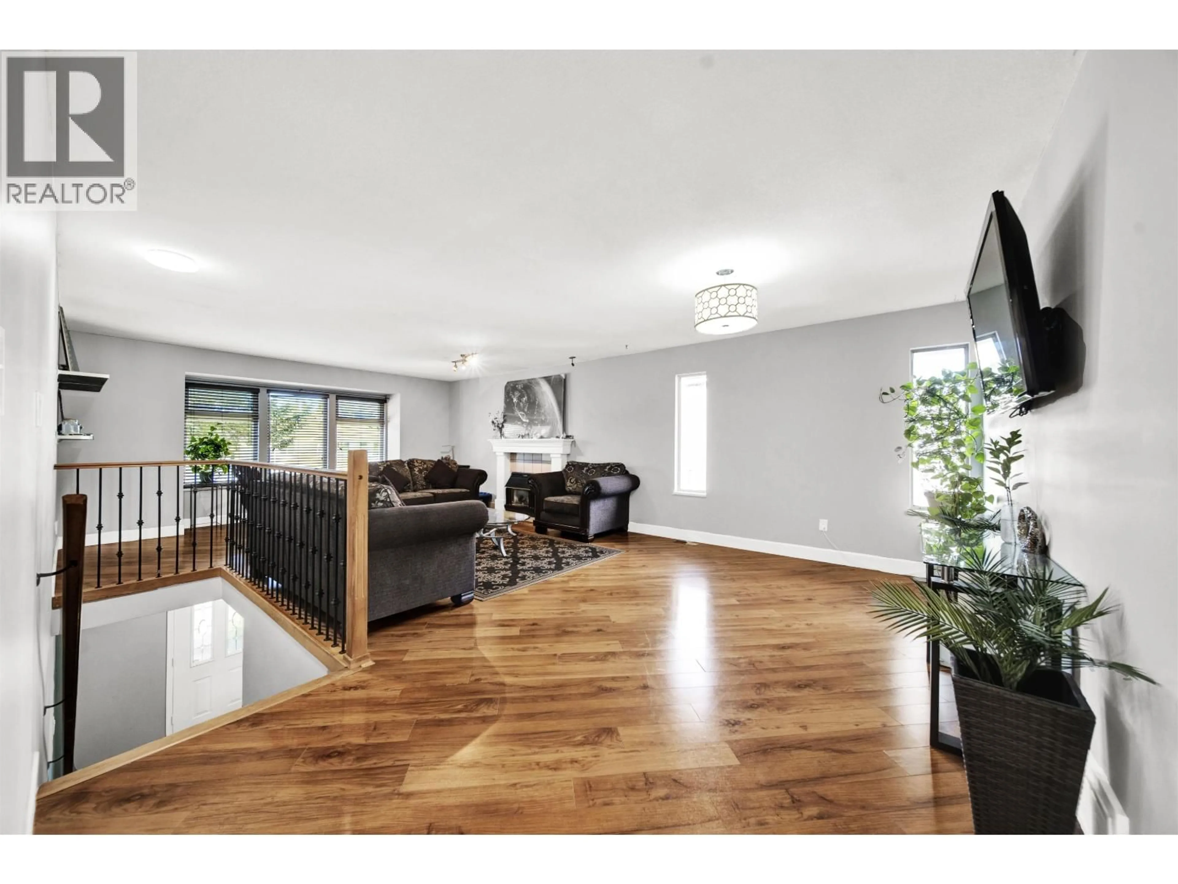Living room with furniture, wood/laminate floor for 12288 233 STREET, Maple Ridge British Columbia V2X0R9
