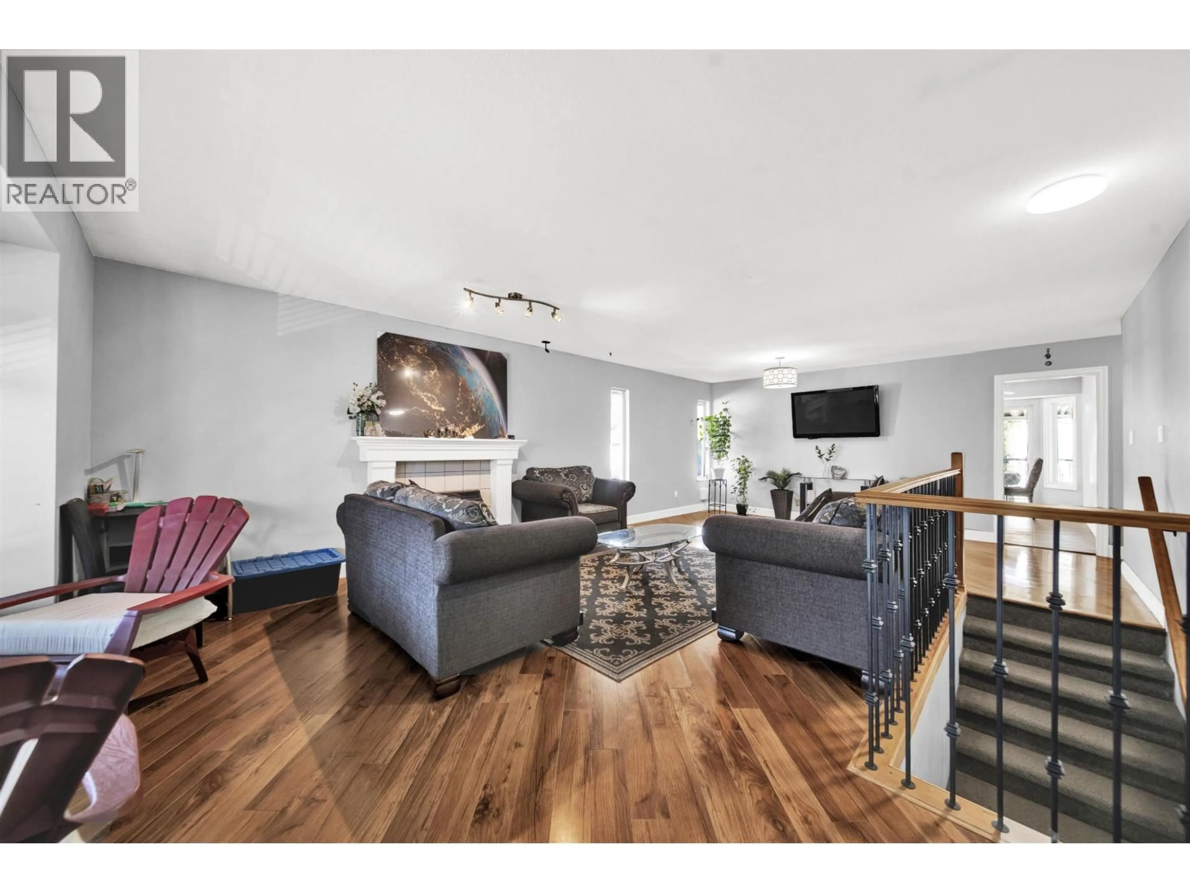 Living room with furniture, wood/laminate floor for 12288 233 STREET, Maple Ridge British Columbia V2X0R9