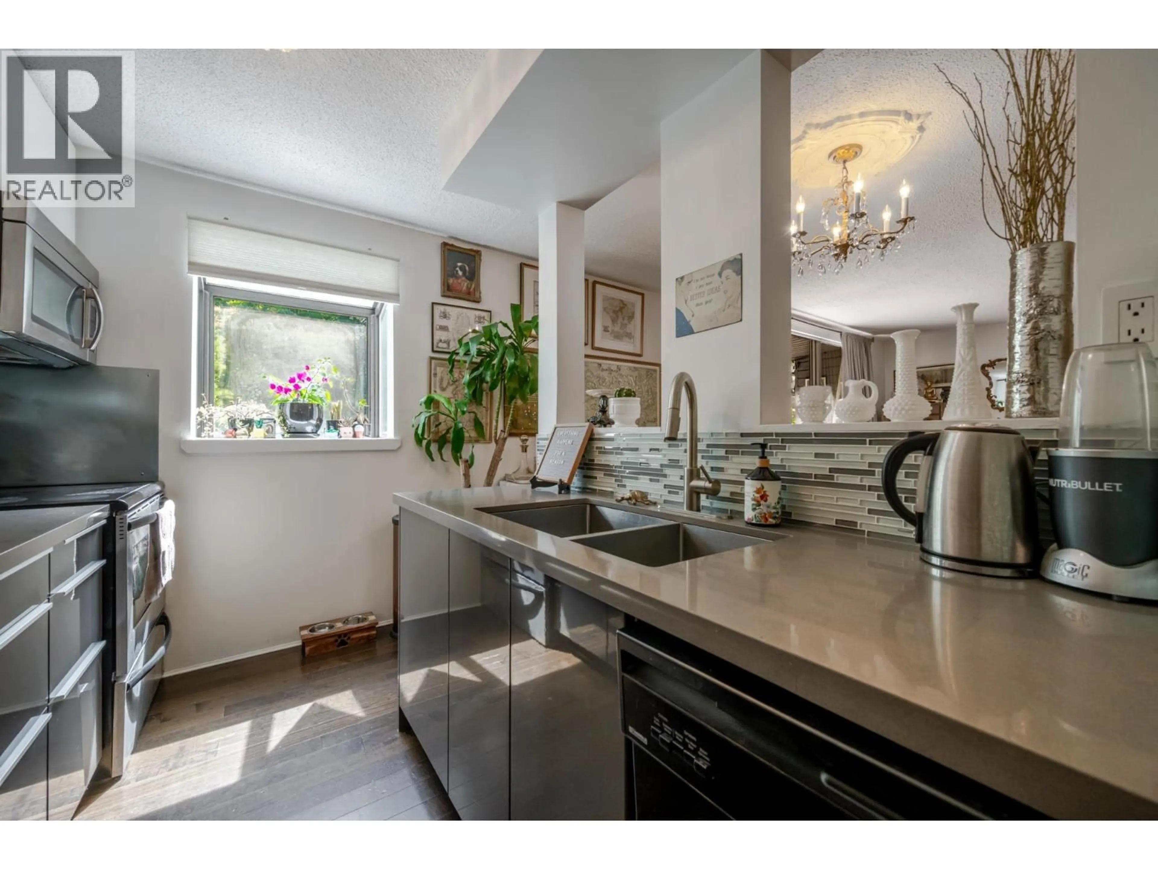 Open concept kitchen, ceramic/tile floor for 101 - 1875 8TH AVENUE, Vancouver British Columbia V6J1V9