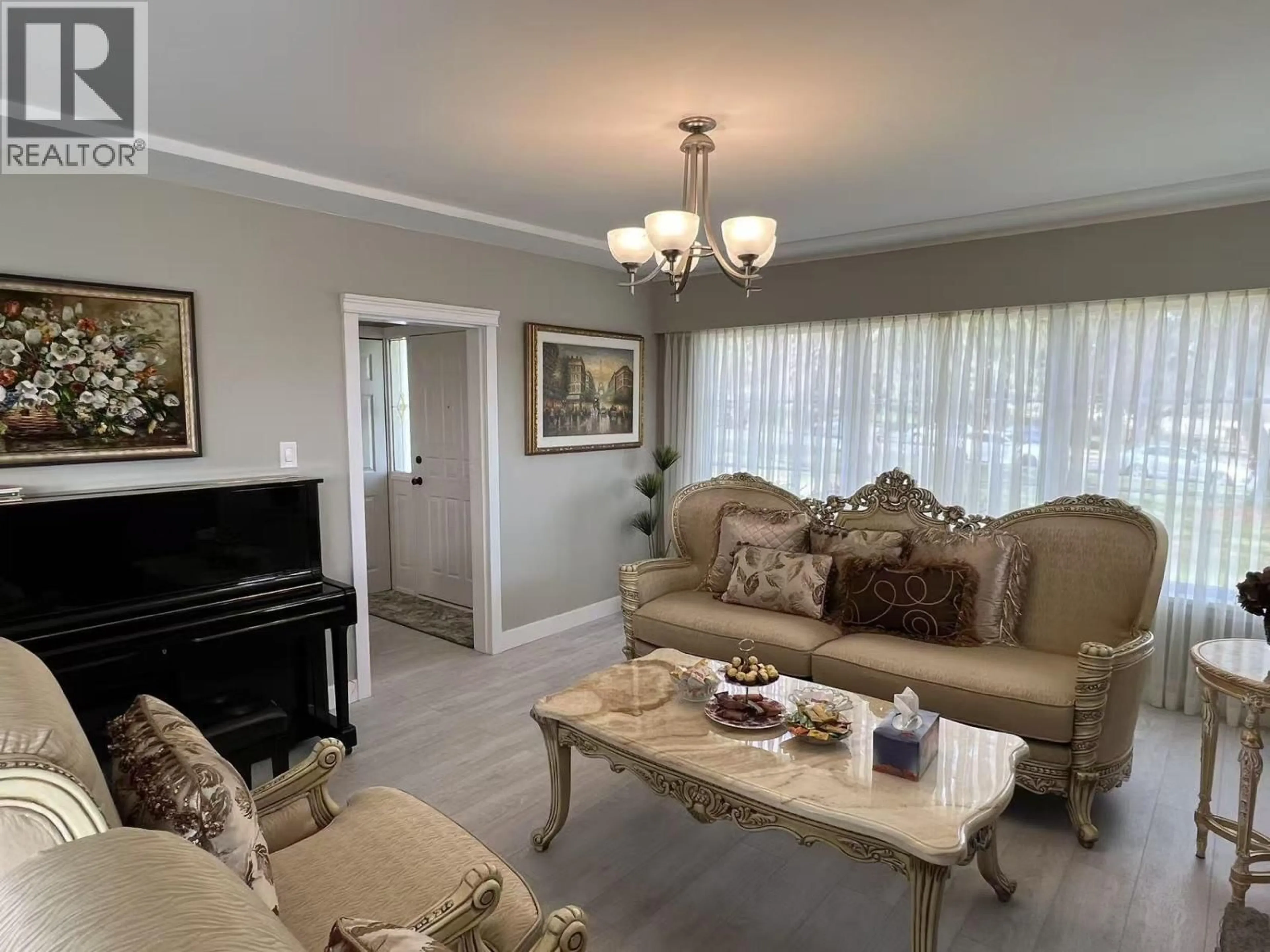 Living room with furniture, wood/laminate floor for 7441 MCKAY AVENUE, Burnaby British Columbia V5J3S9