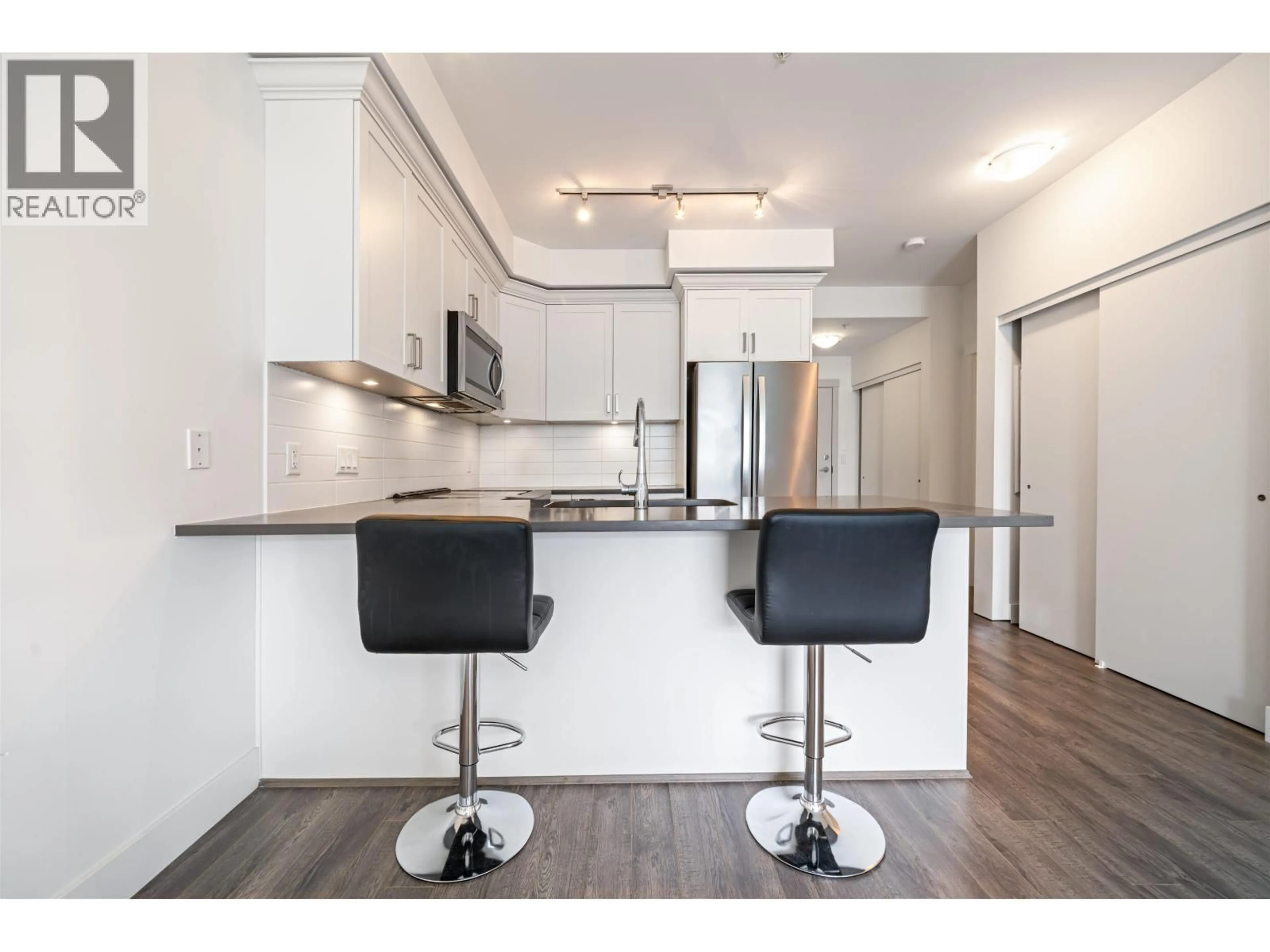 Open concept kitchen, wood/laminate floor for 314 - 2436 KELLY AVENUE, Port Coquitlam British Columbia V3C1Y4