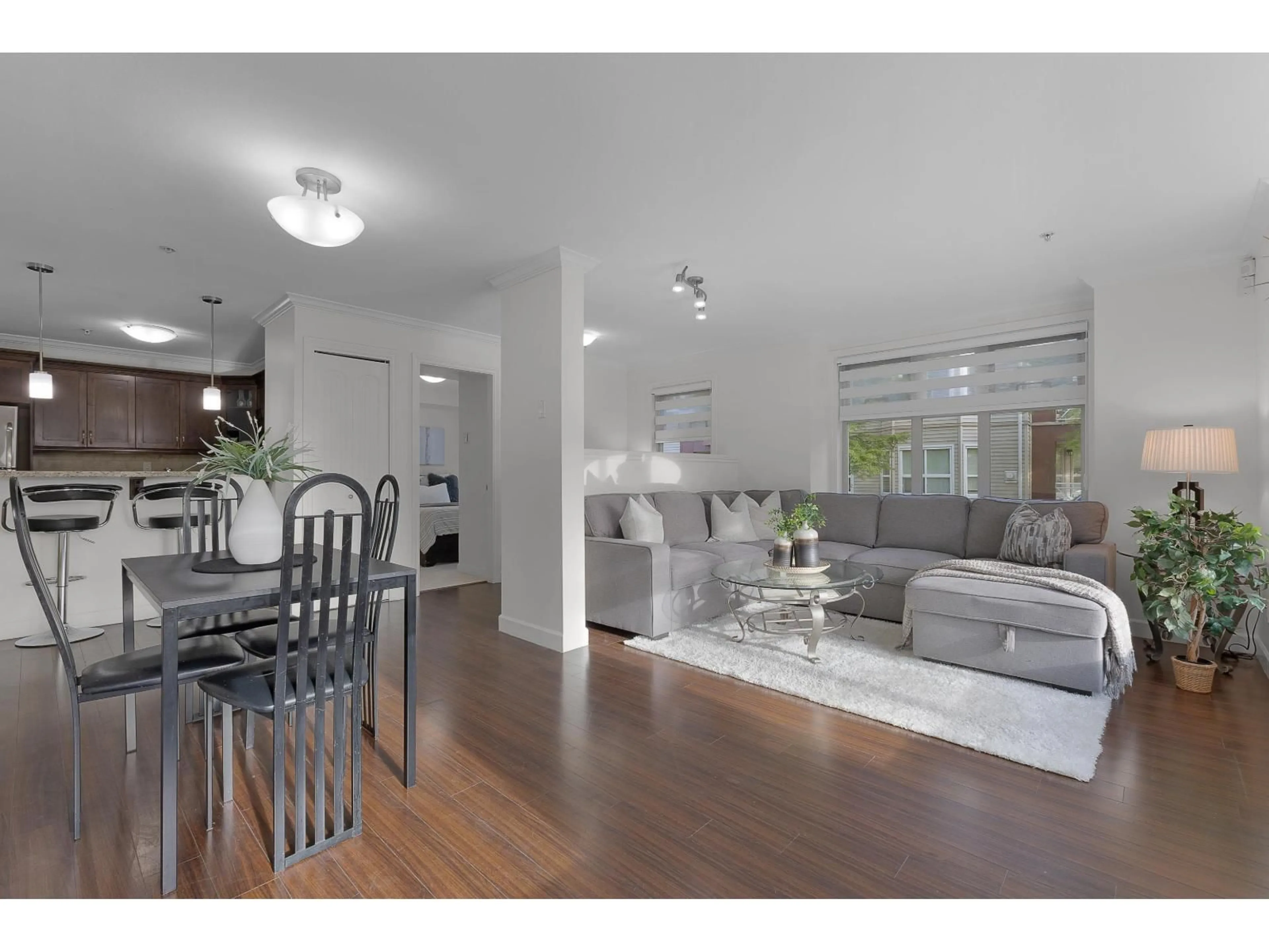 Living room with furniture, wood/laminate floor for 202 - 8084 120A STREET, Surrey British Columbia V3W1V2