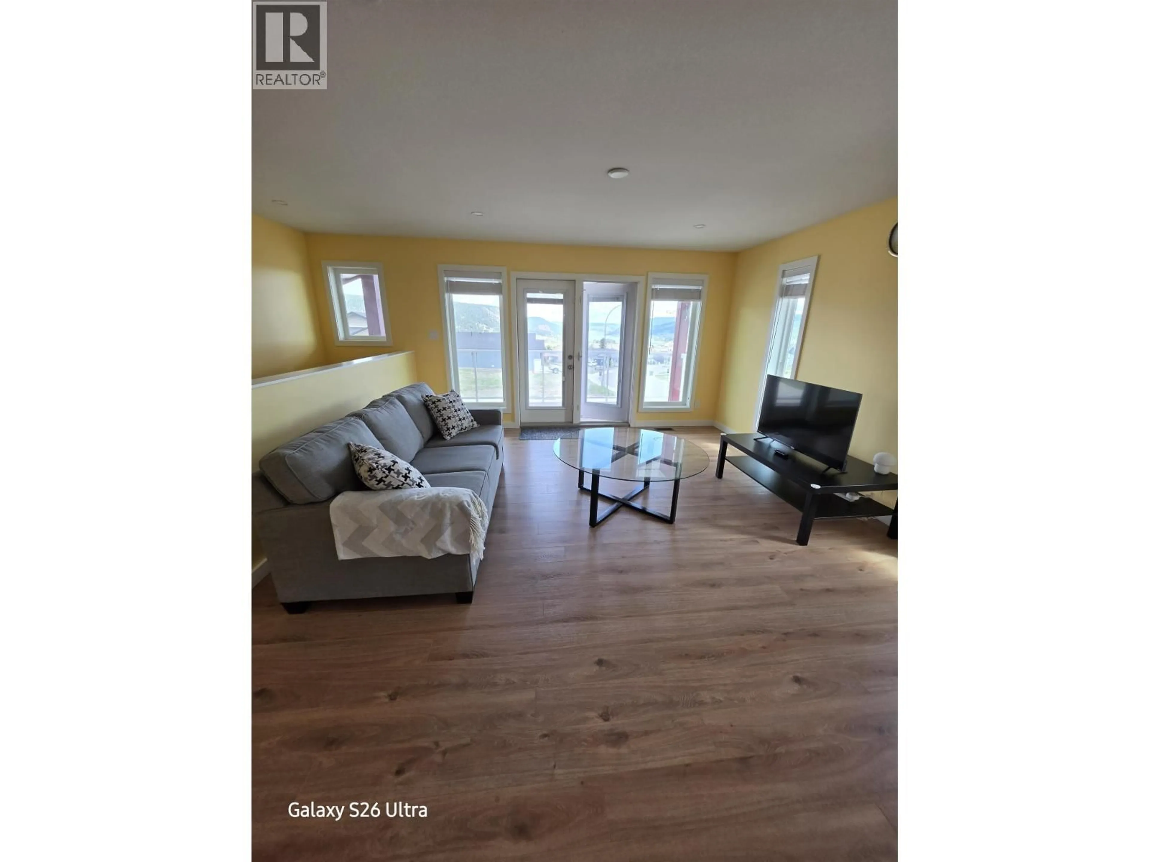 Living room with furniture, wood/laminate floor for 149 - 375 MANDARINO PLACE, Williams Lake British Columbia V2G4V3